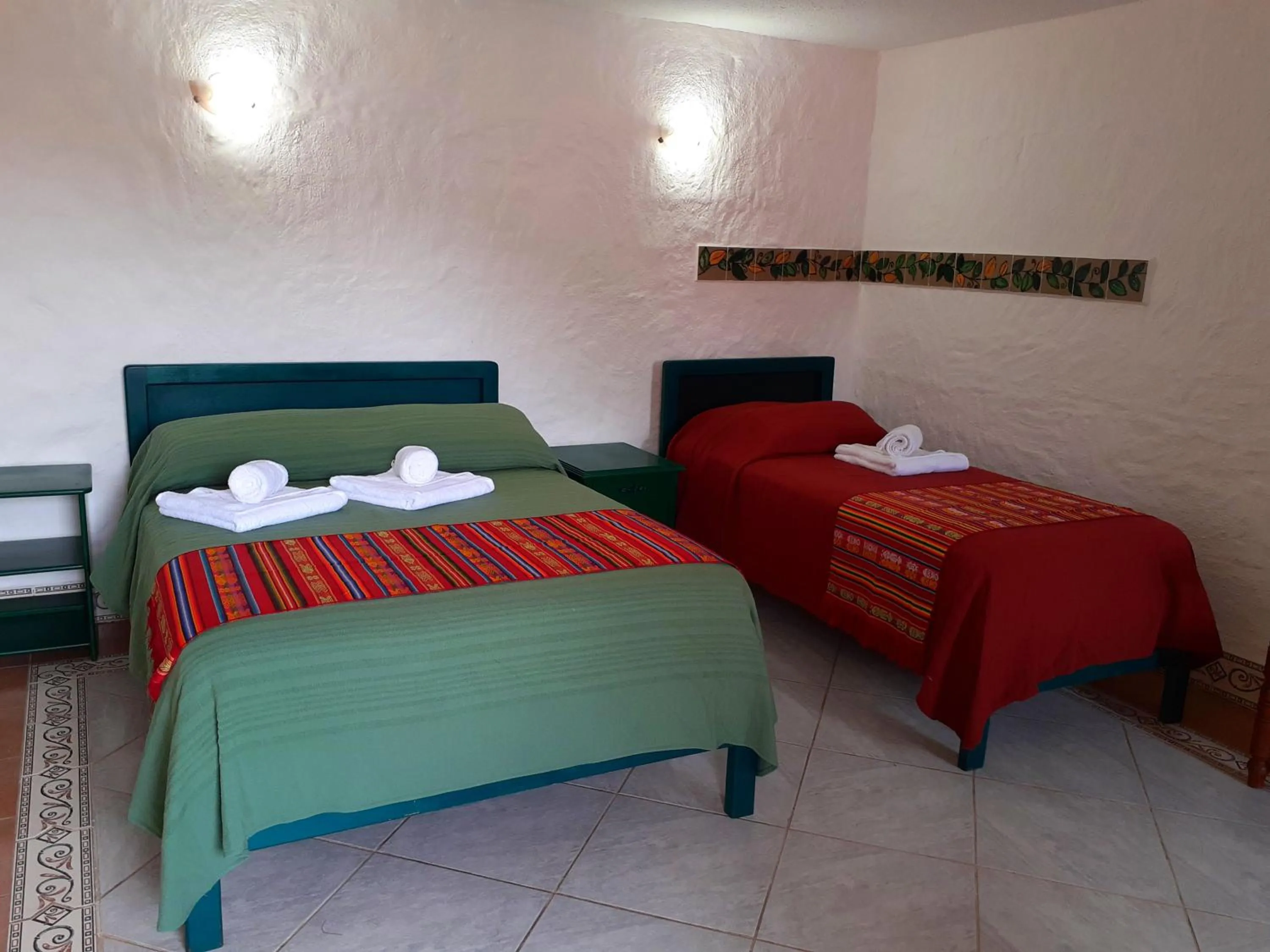 Bed in CasKaffeSu Hotel and Restaurant Mindo