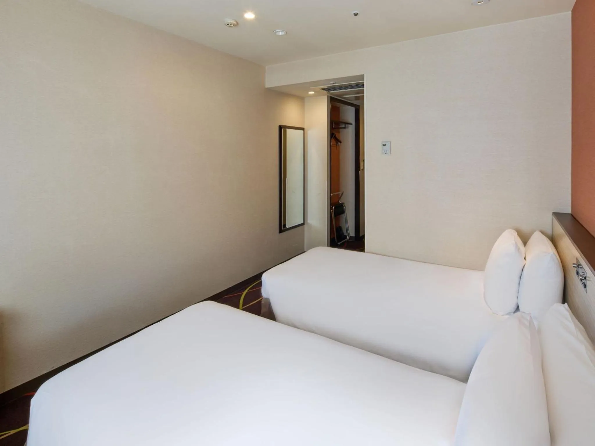 Bed in Okinawa NaHaNa Hotel & Spa