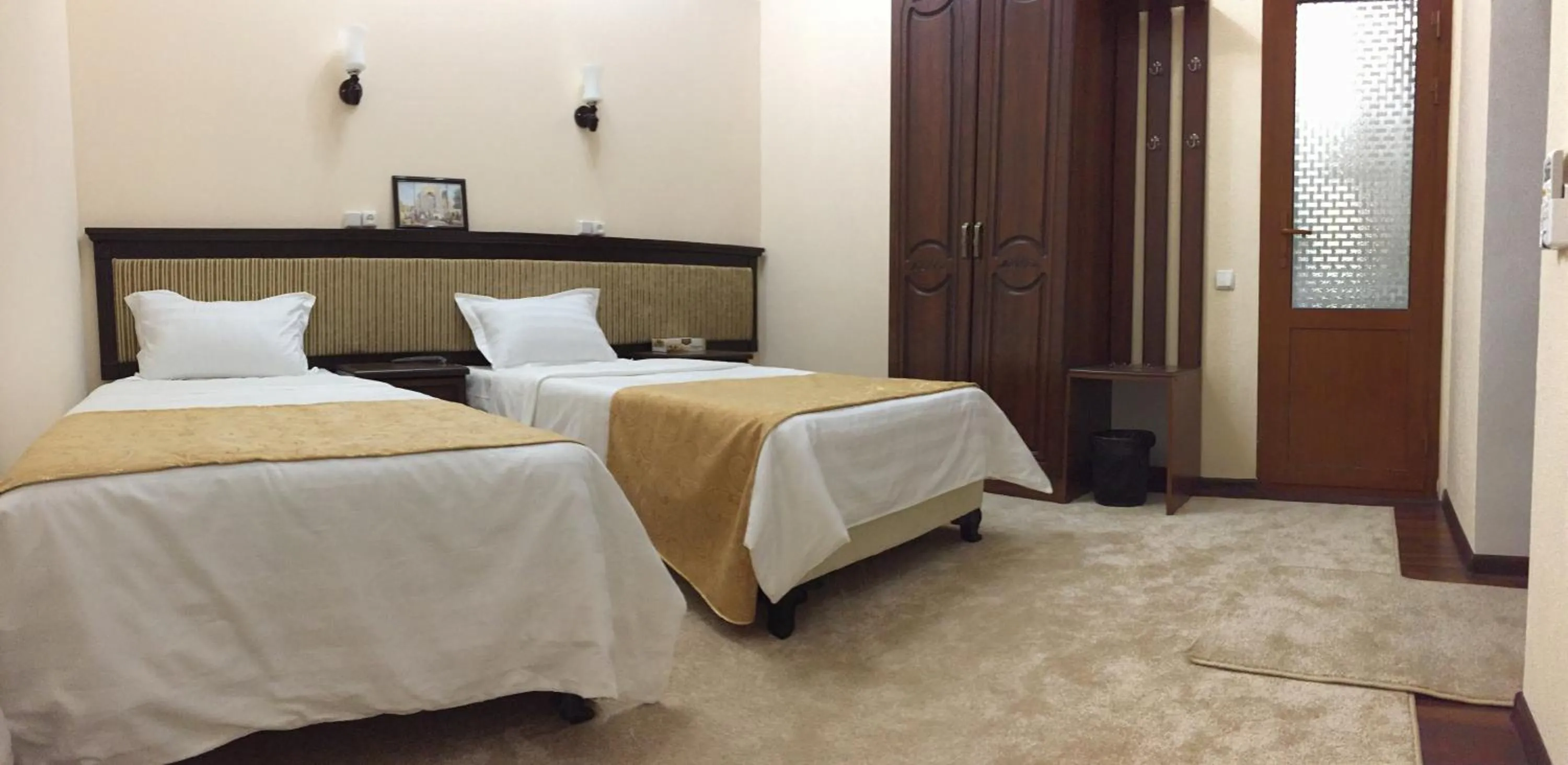 Bed in Muzaffar Hotel Samarkand