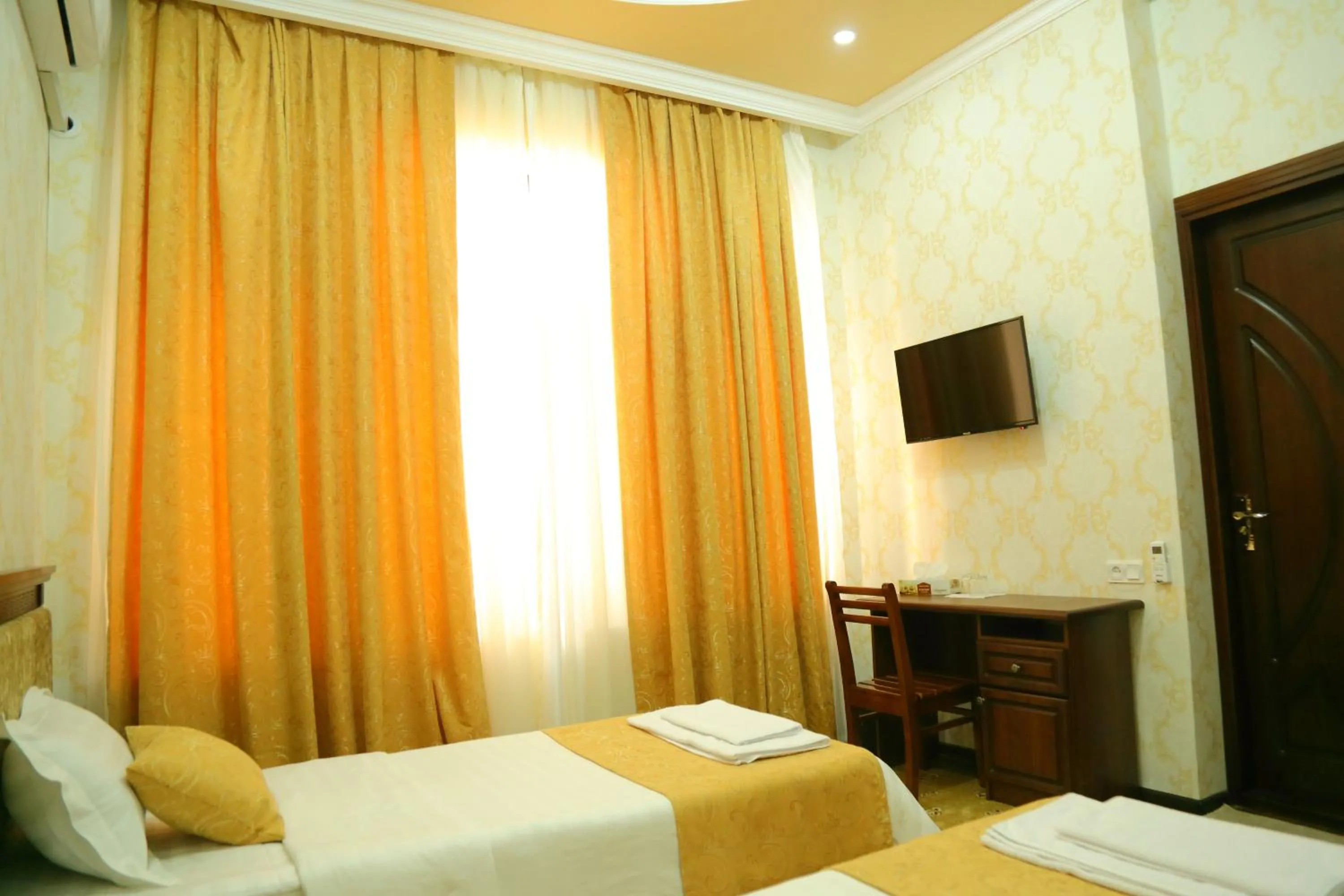 Bed in Muzaffar Hotel Samarkand