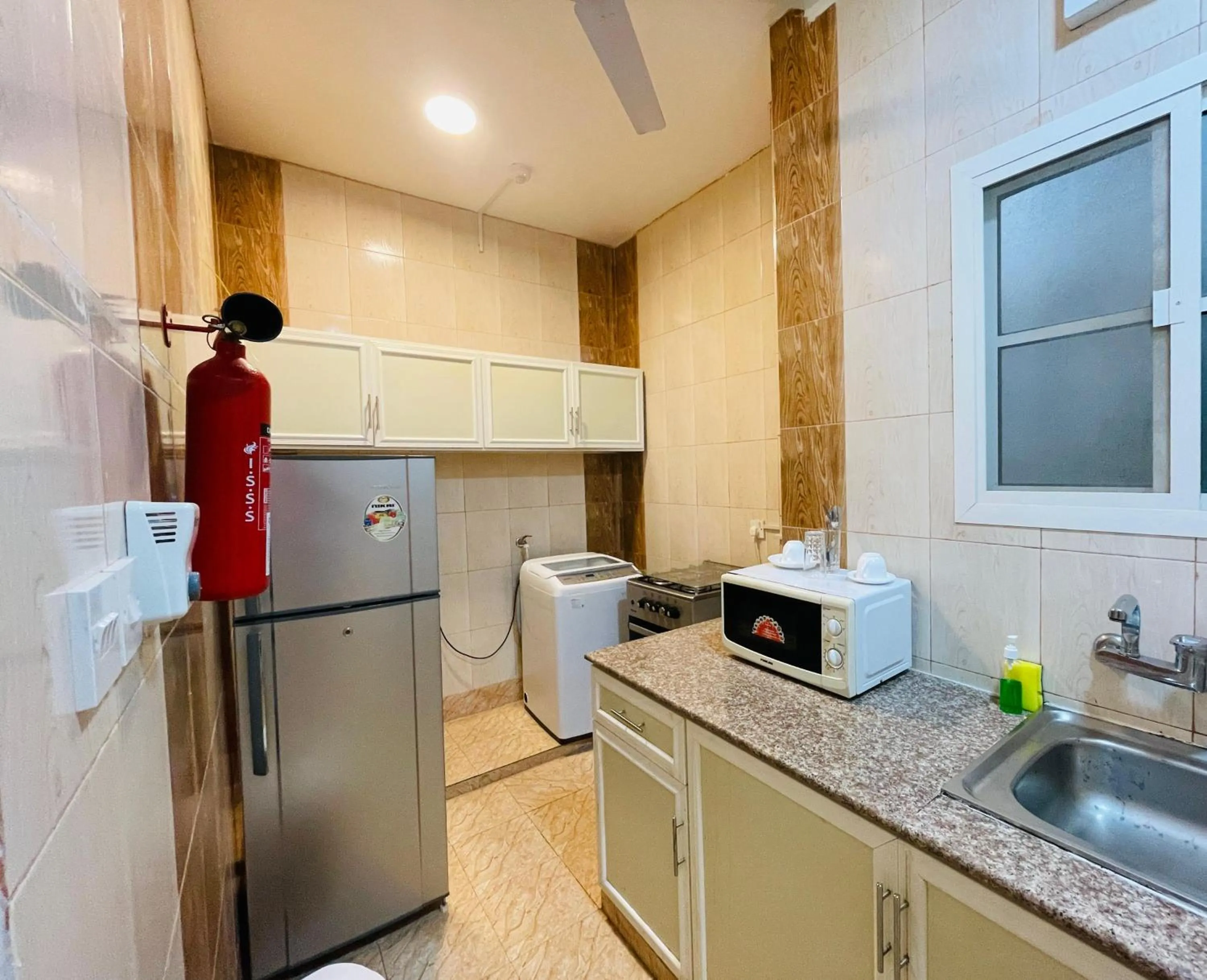 Kitchen or kitchenette in Gateway Salalah hotel apartments