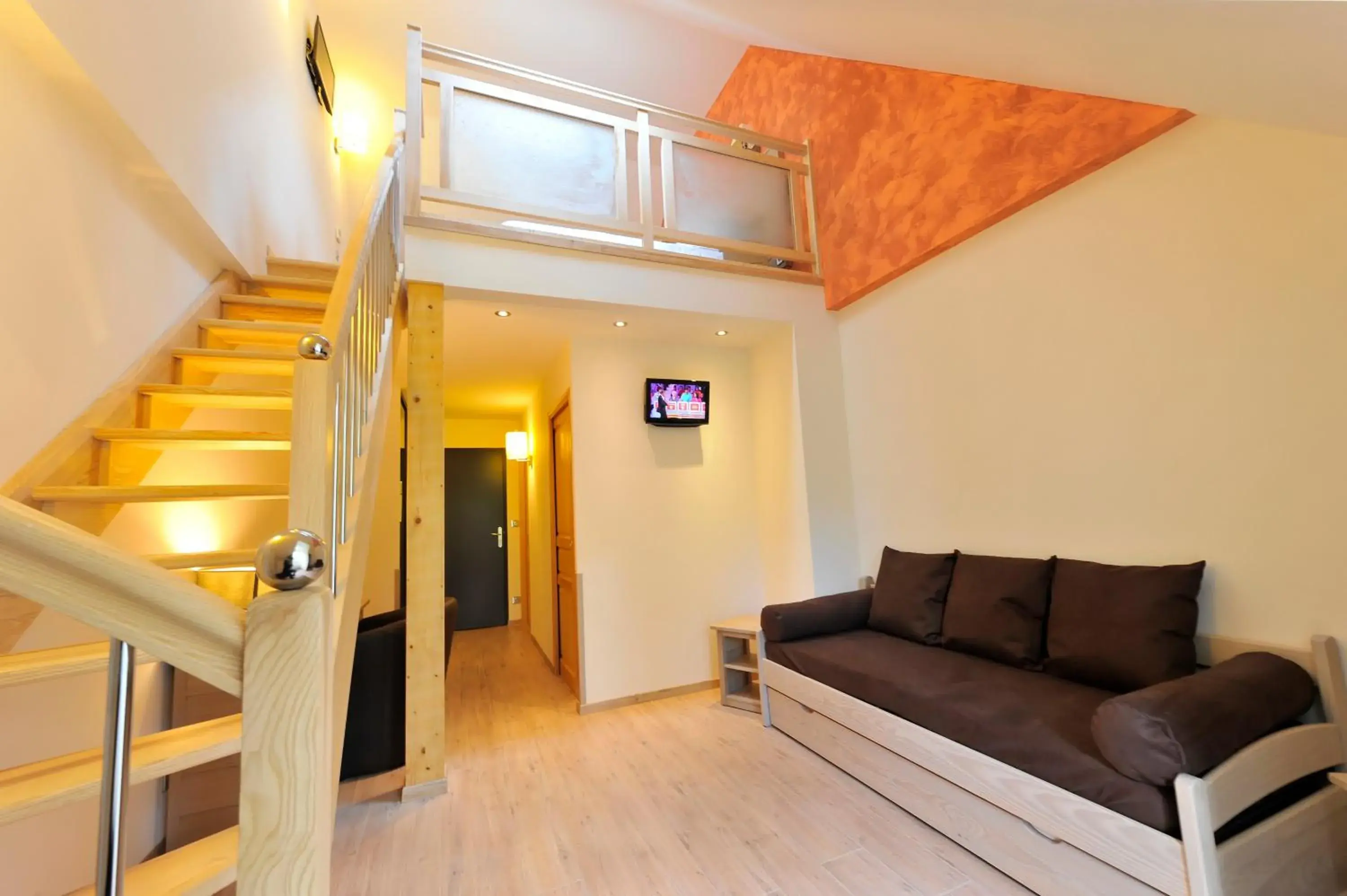 Living room in Logis Hôtel Restaurant Les 2 Rives - A75, en bordure de rivière Living room in Logis Hôtel Restaurant Les 2 Rives - A75, en bordure de rivière