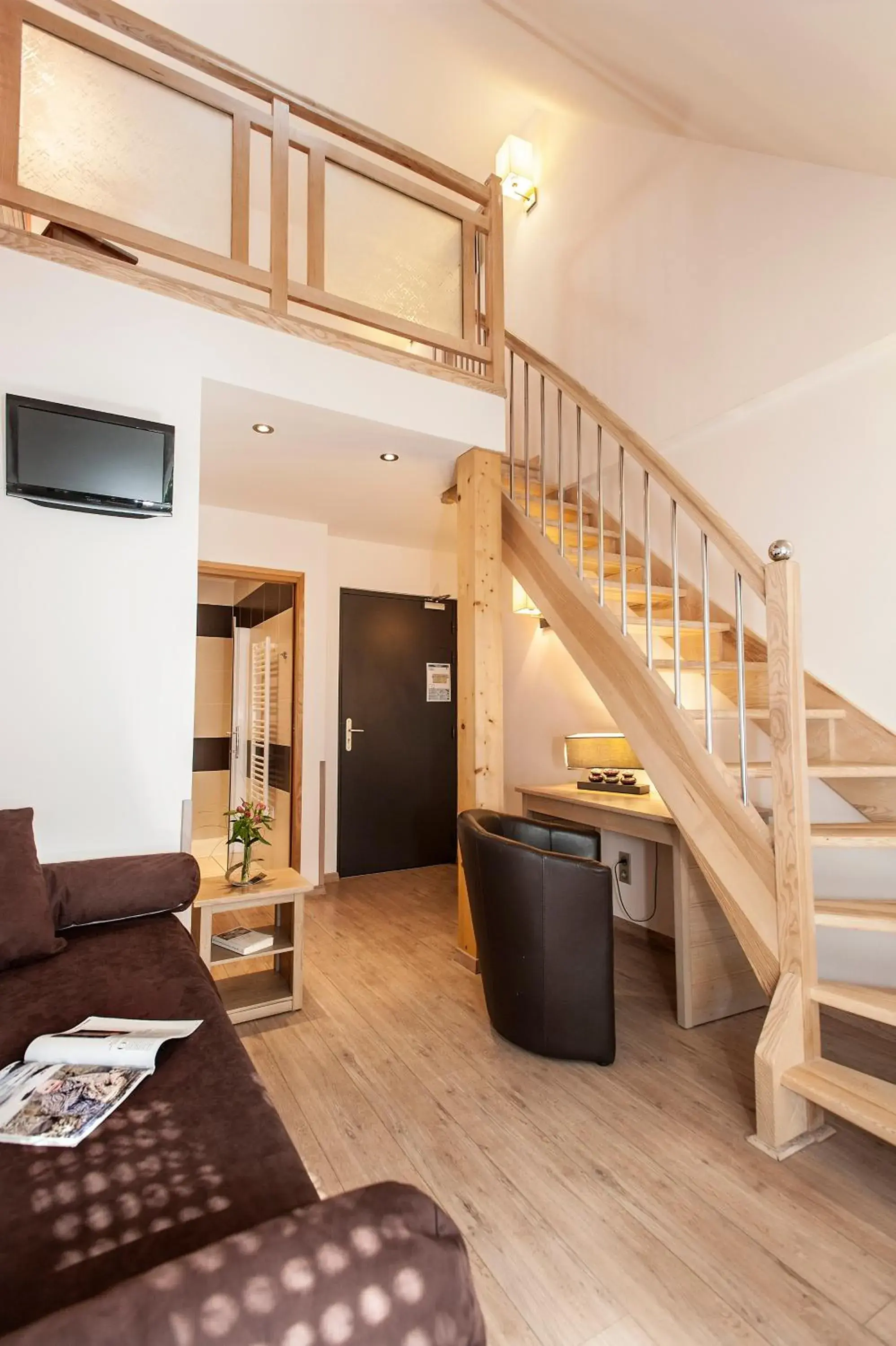 Living room in Logis Hôtel Restaurant Les 2 Rives - A75, en bordure de rivière Living room in Logis Hôtel Restaurant Les 2 Rives - A75, en bordure de rivière