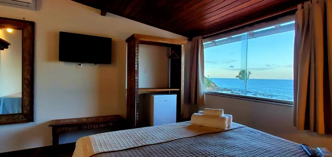 Bed in Pousada Ilha da Saudade