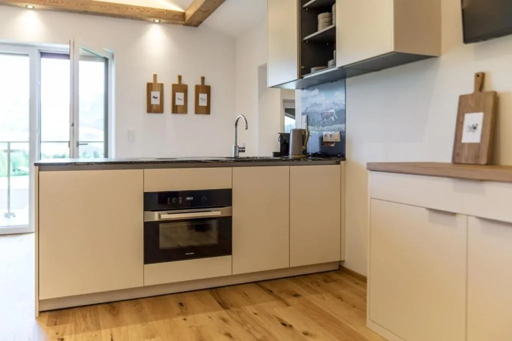 Kitchen or kitchenette in Almfrieden Hotel & Romantikchalet