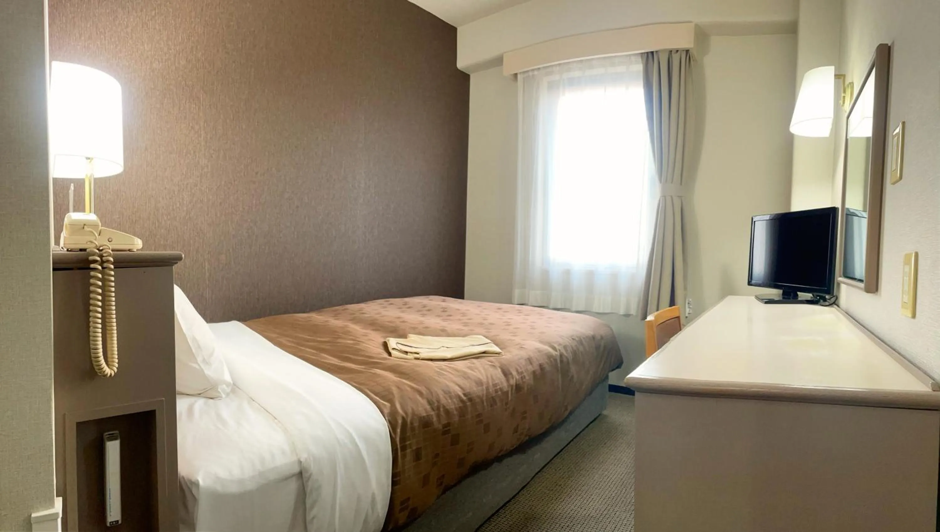 Bed in Yono Daiichi Hotel