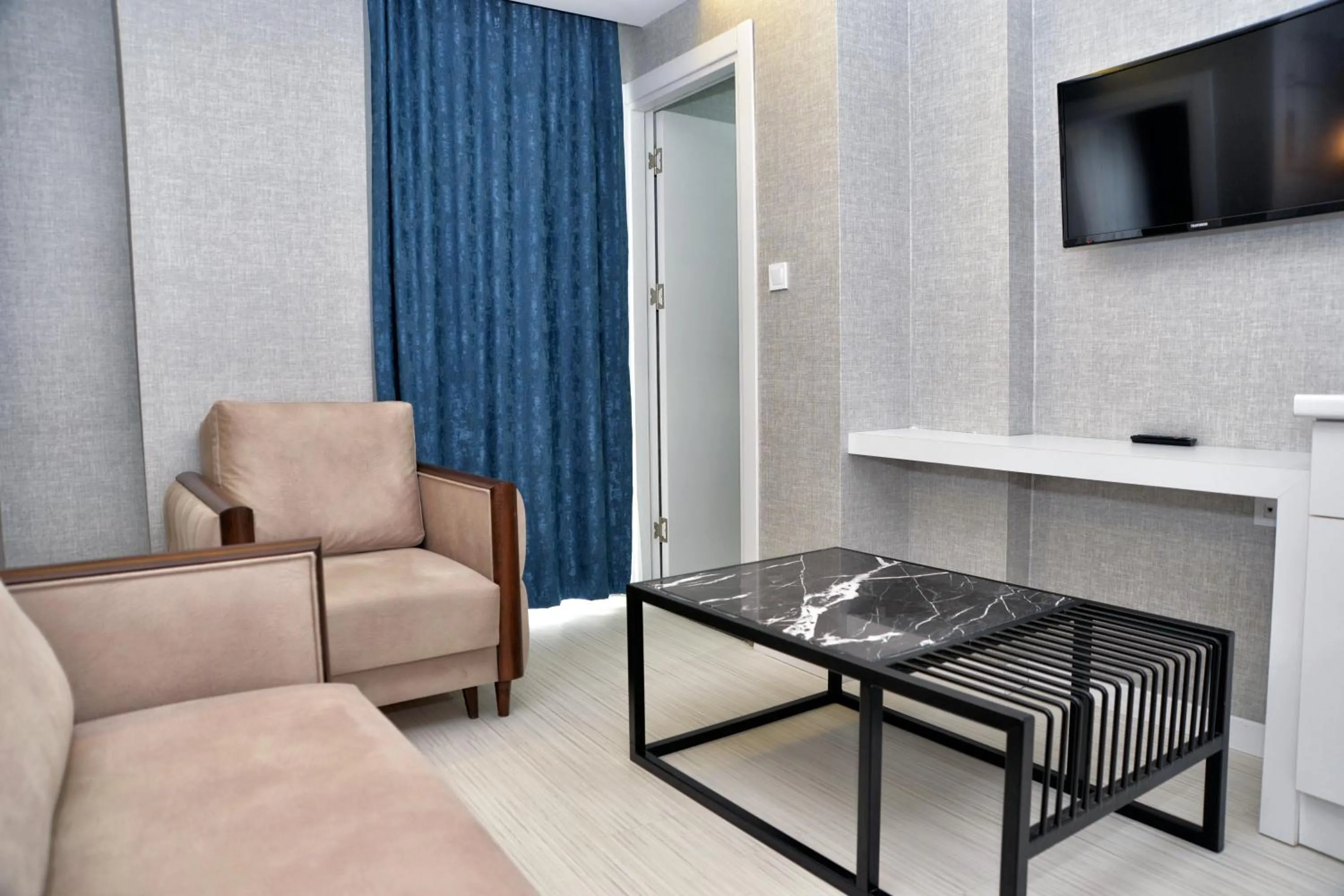 Seating area in Gardenya Suite Hotel