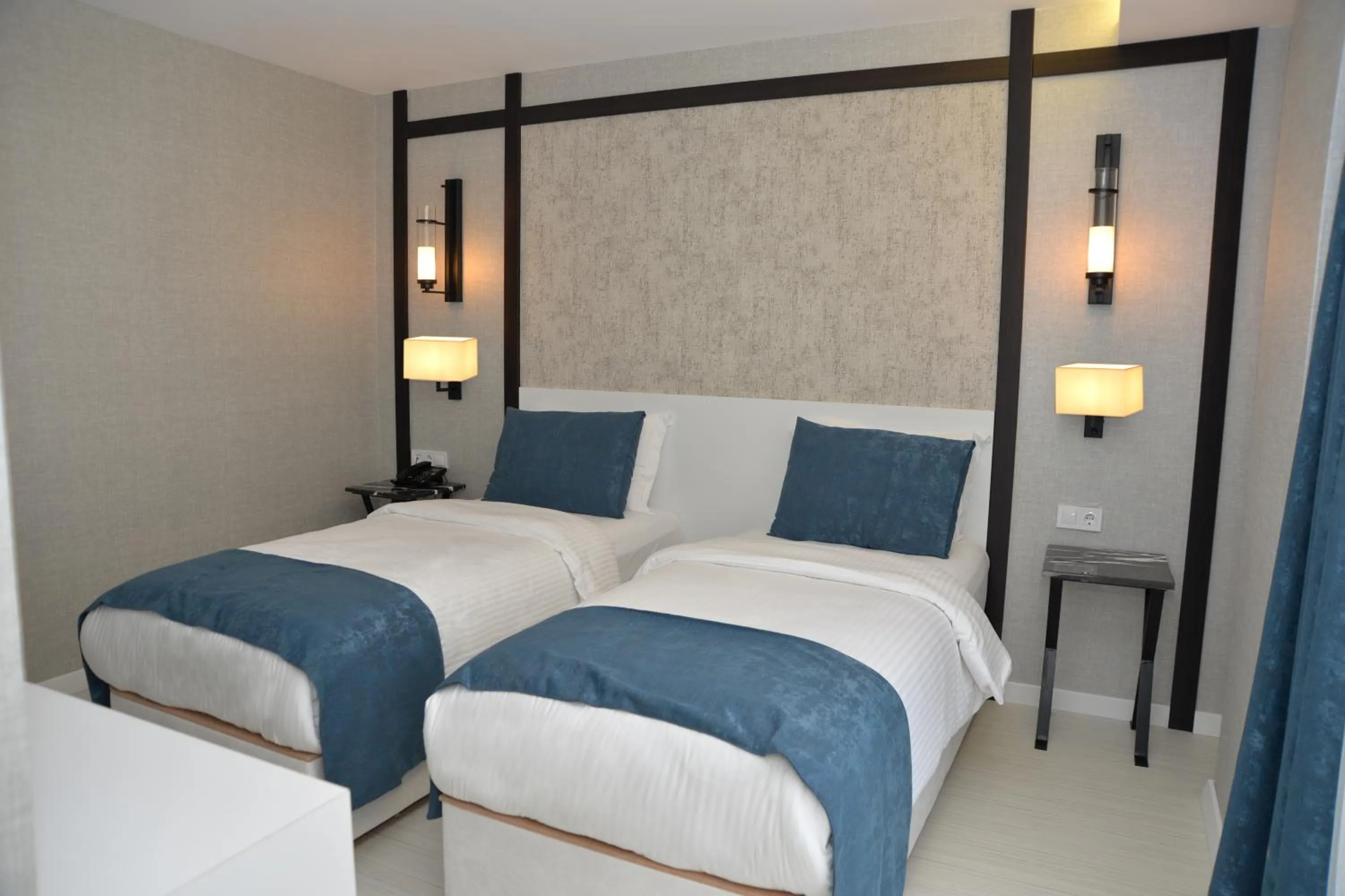 Bed in Gardenya Suite Hotel