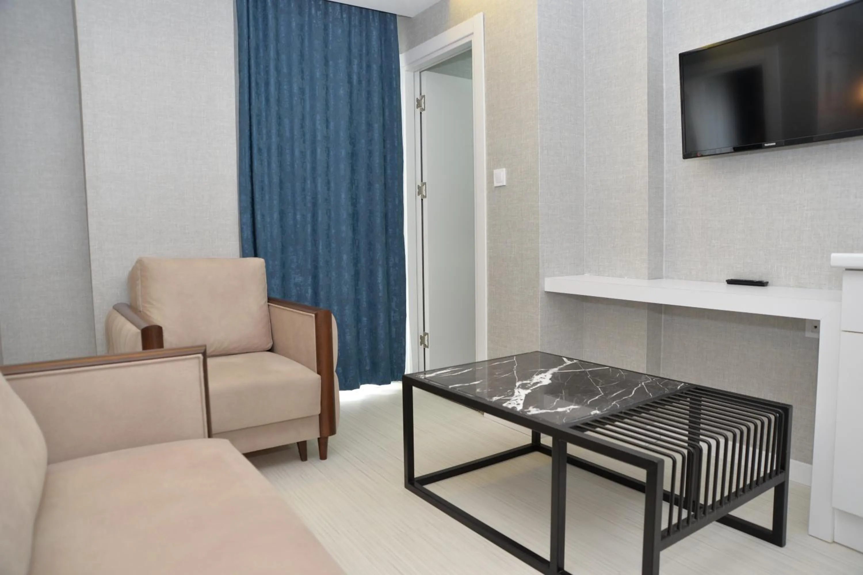 Seating area in Gardenya Suite Hotel