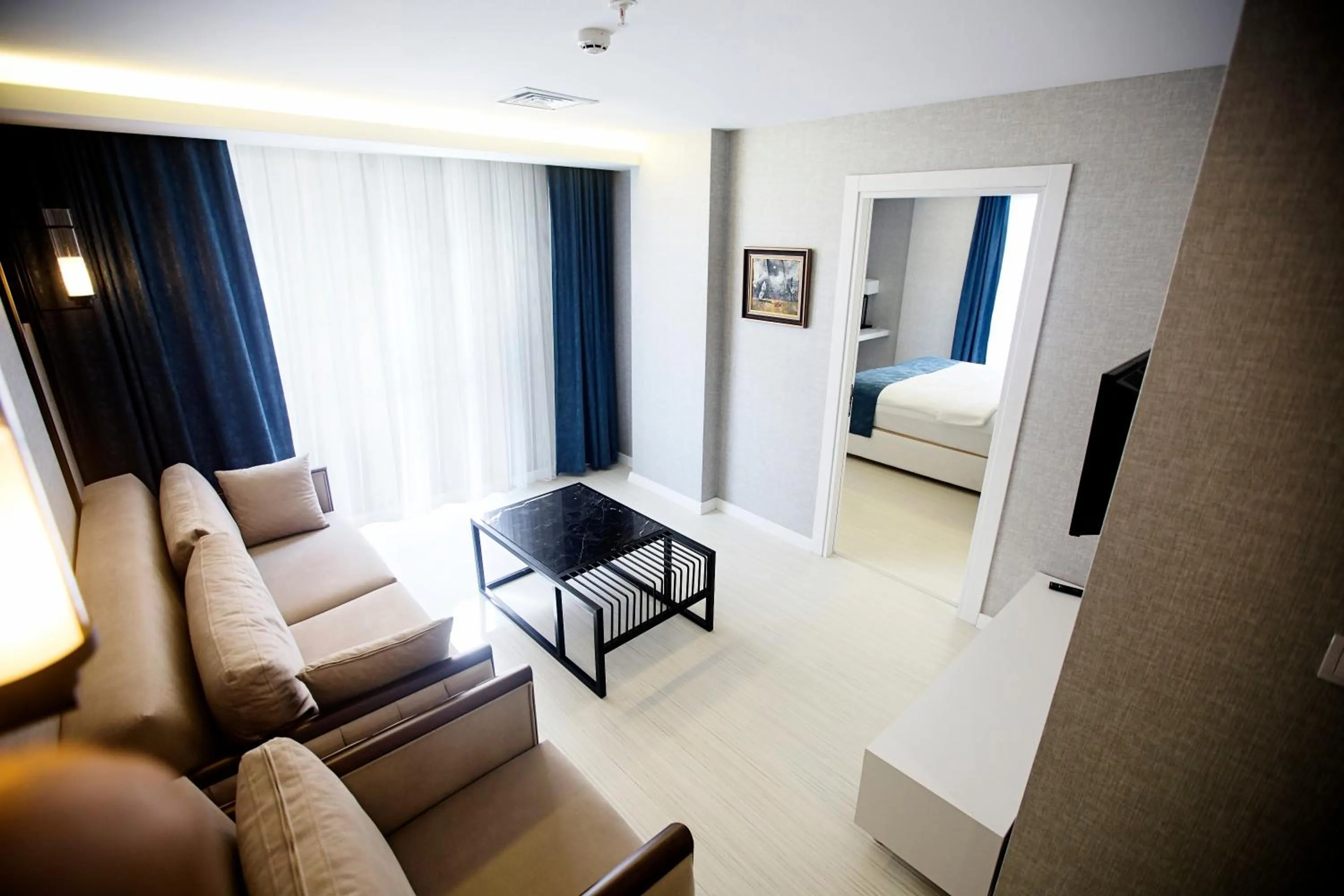 Seating area, Bed in Gardenya Suite Hotel