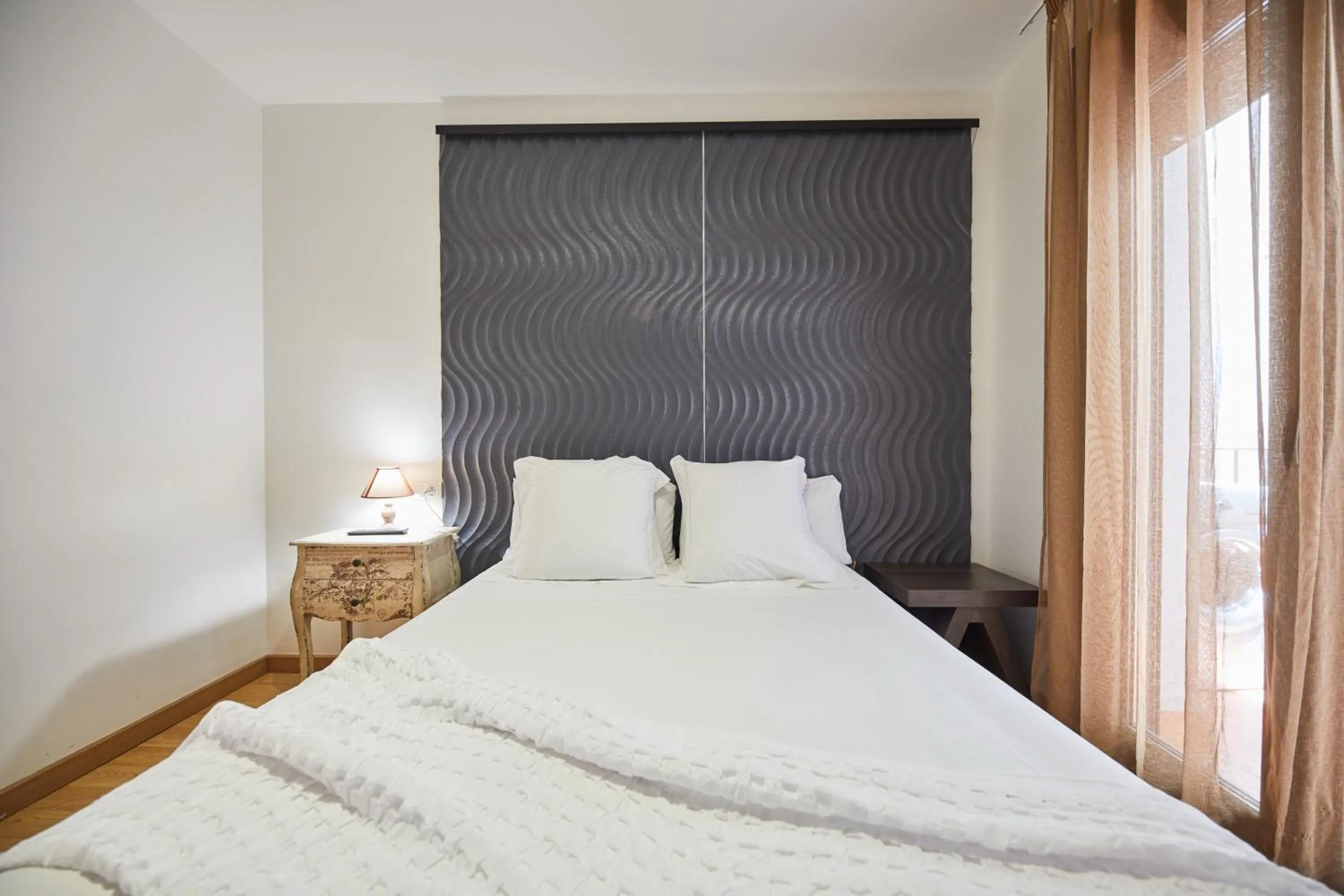 Bed in Apart-Suites Hostemplo