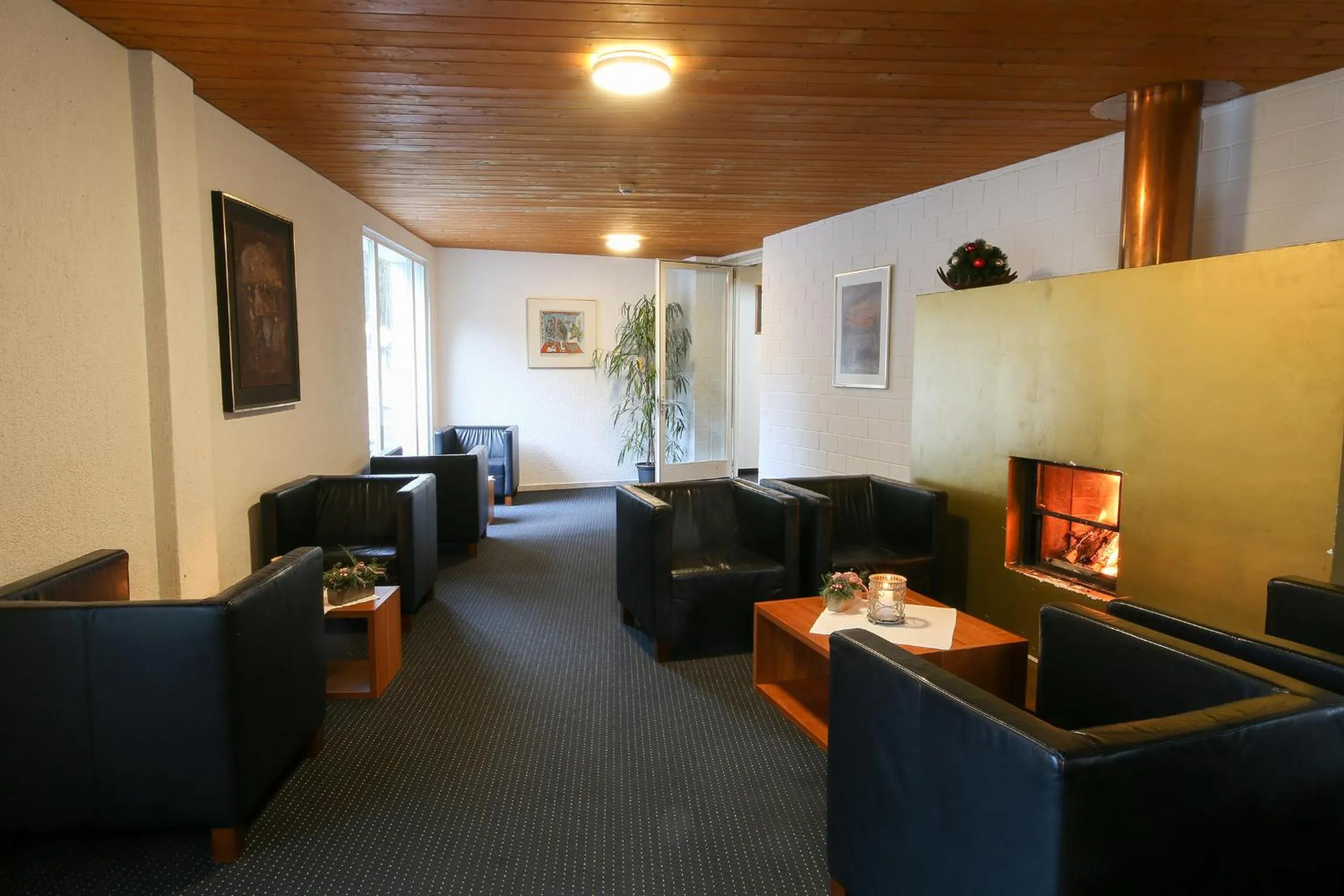 Communal lounge/ TV room in Hotel Grüsch