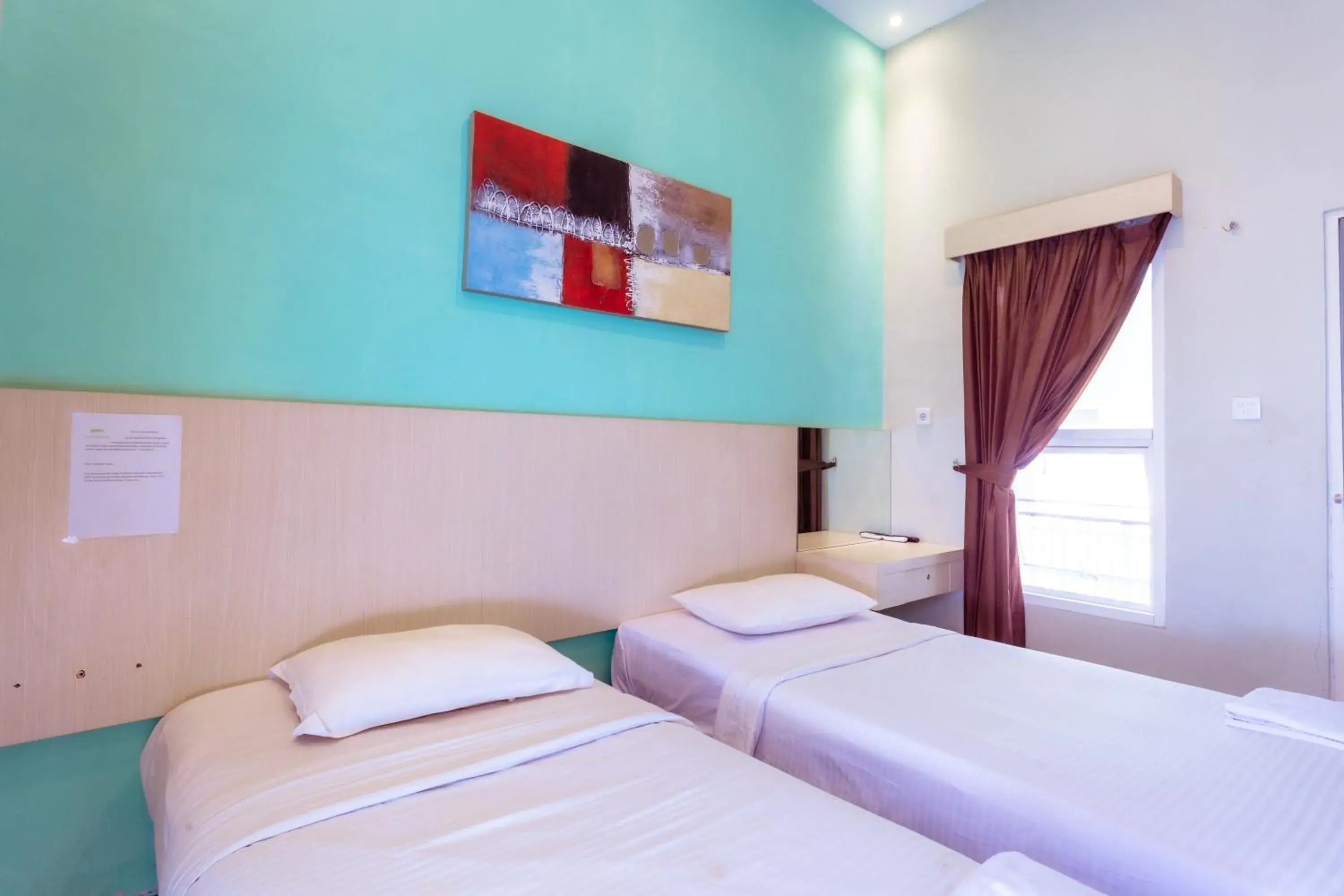 Bed in Ardhya Guesthouse Syariah by ecommerceloka Bed in Ardhya Guesthouse Syariah by ecommerceloka