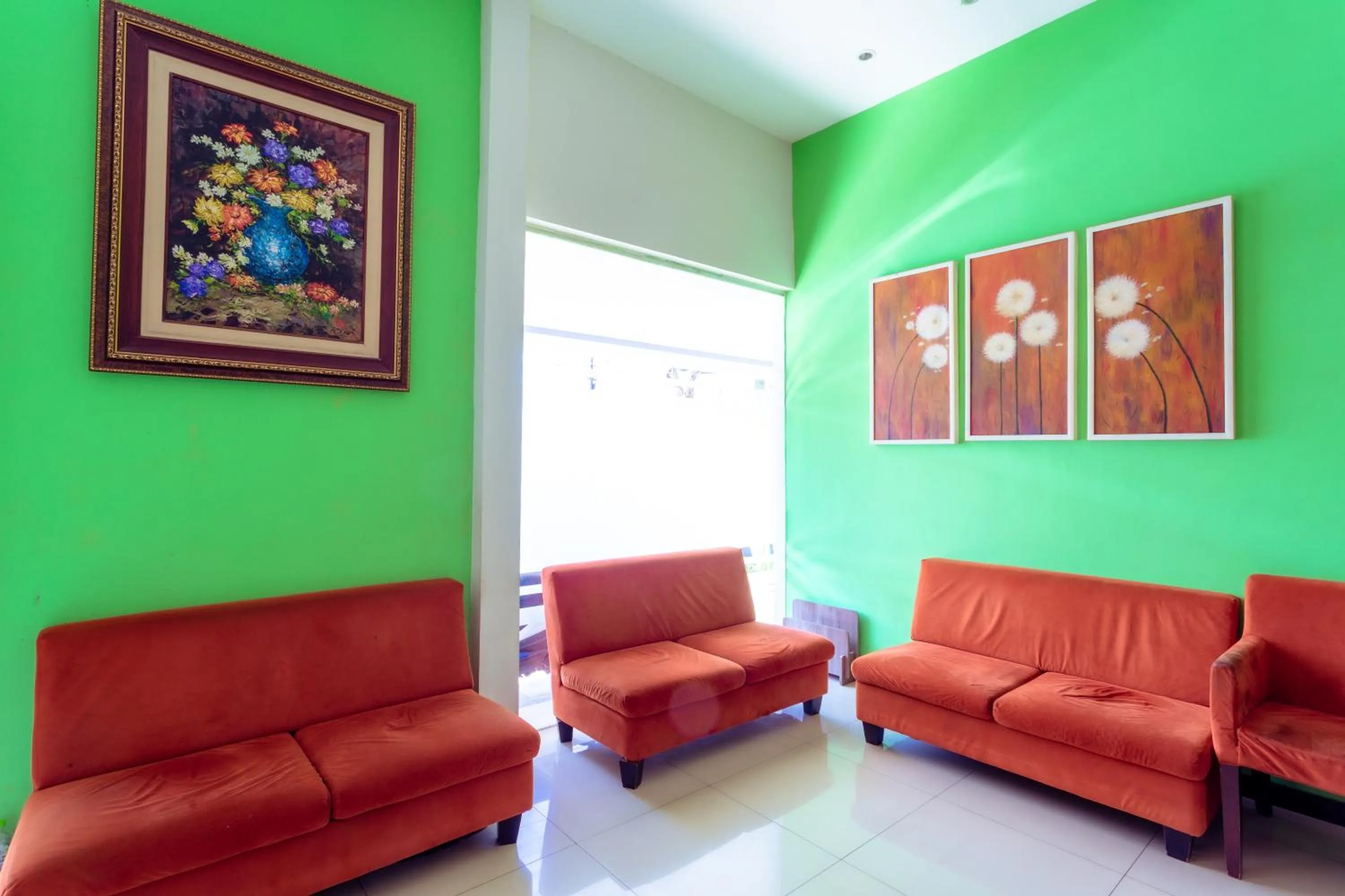 Seating area in Ardhya Guesthouse Syariah by ecommerceloka