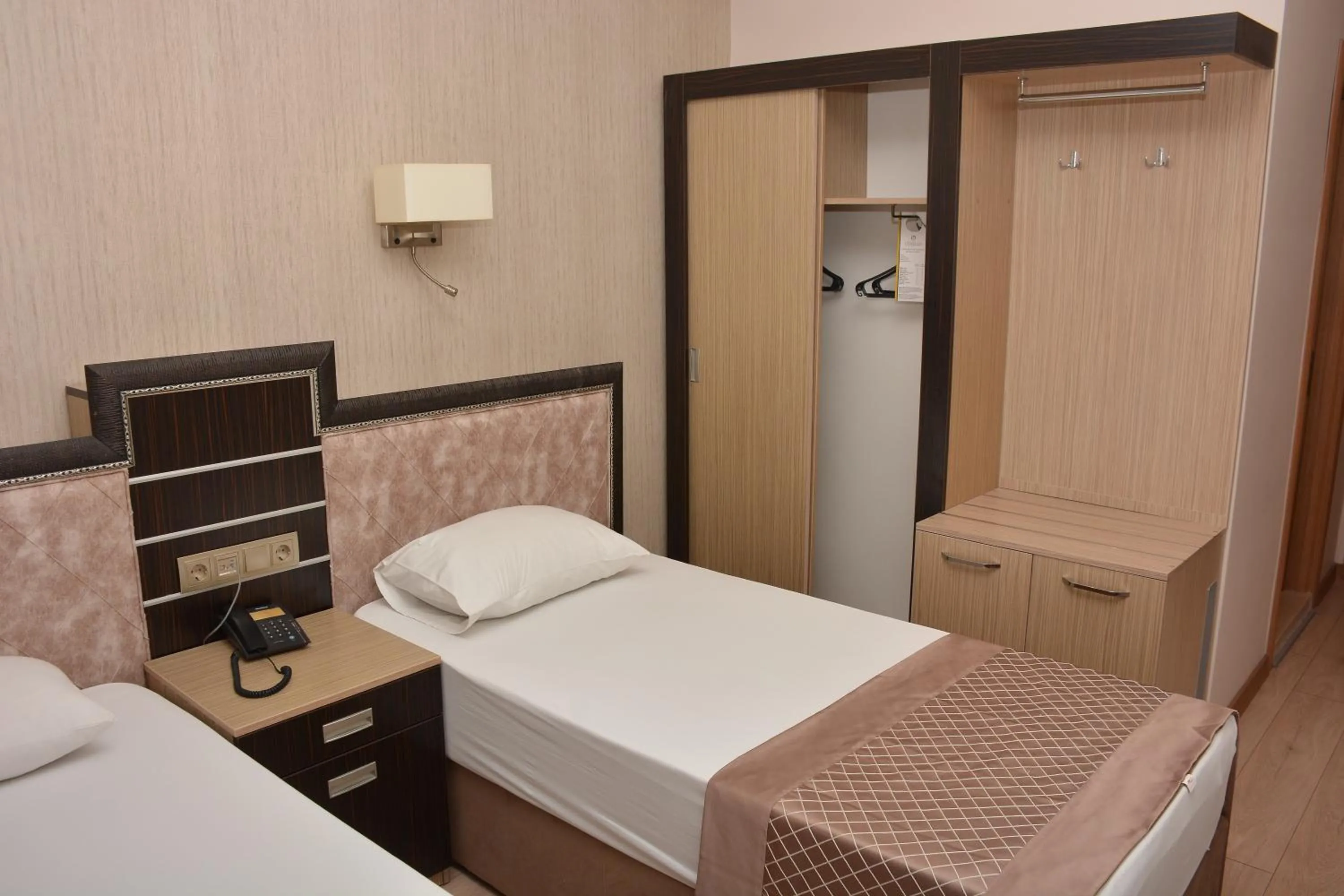 Bed in Othello Hotel