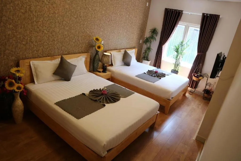 Bed in Redhouse Dalat Hotel
