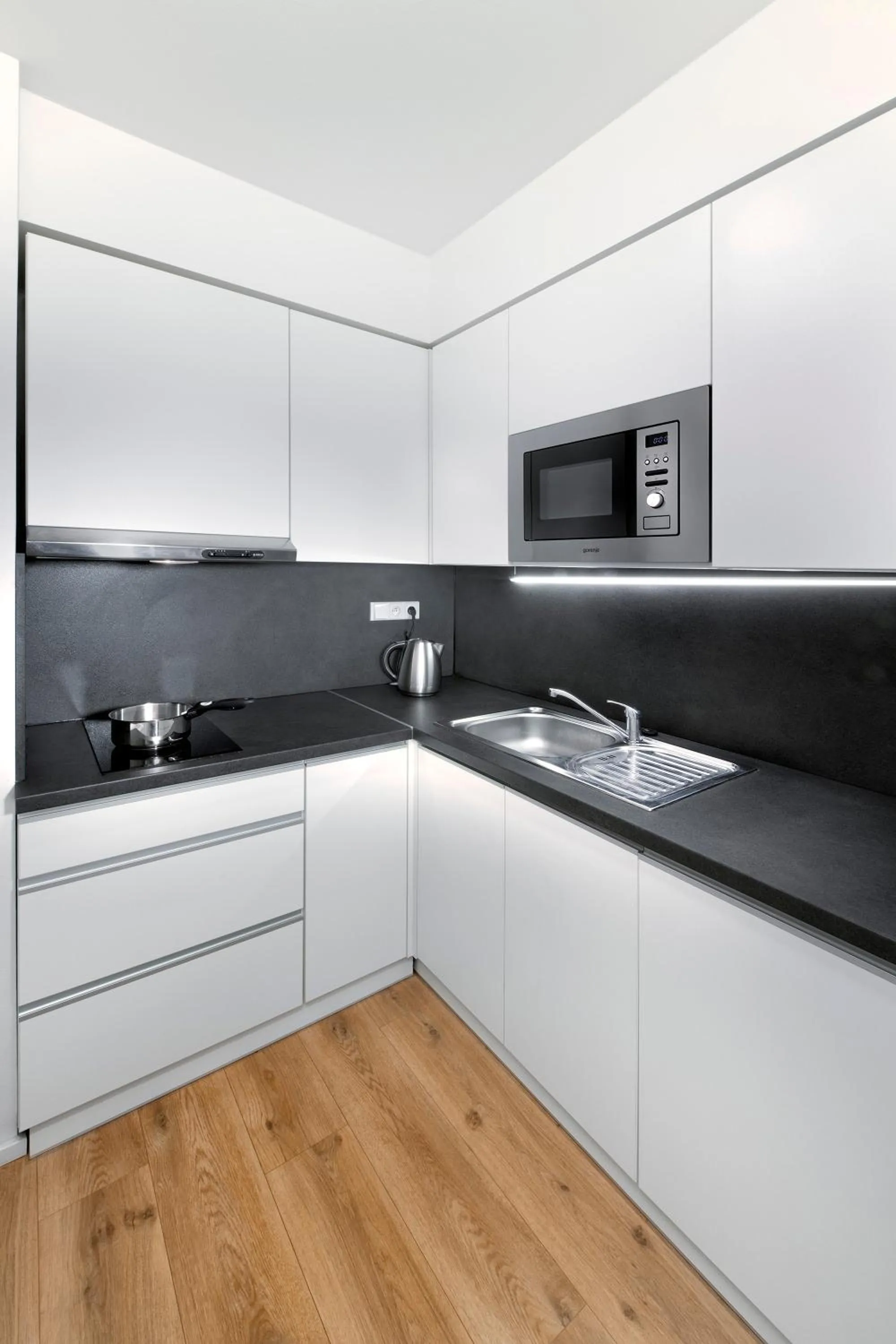Kitchen or kitchenette in DownTown Suites Belohorska