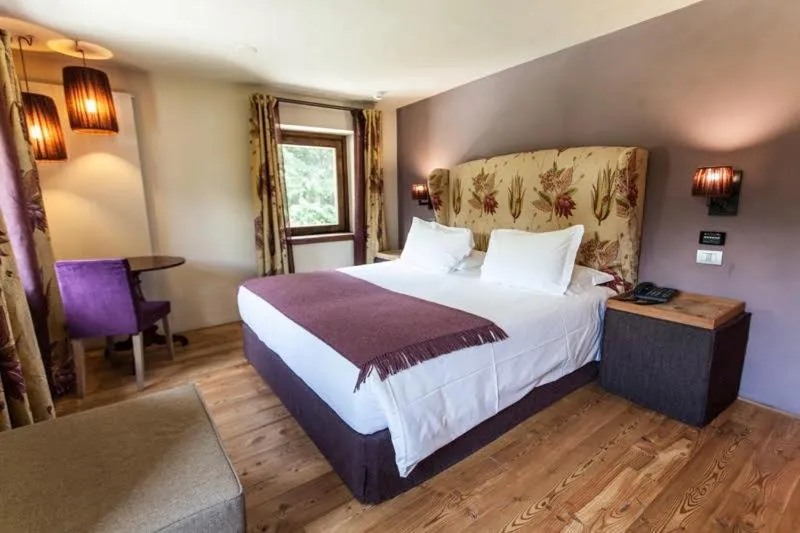 Bed in Chalet Eden Eco Hotel, Restaurant & Wellness