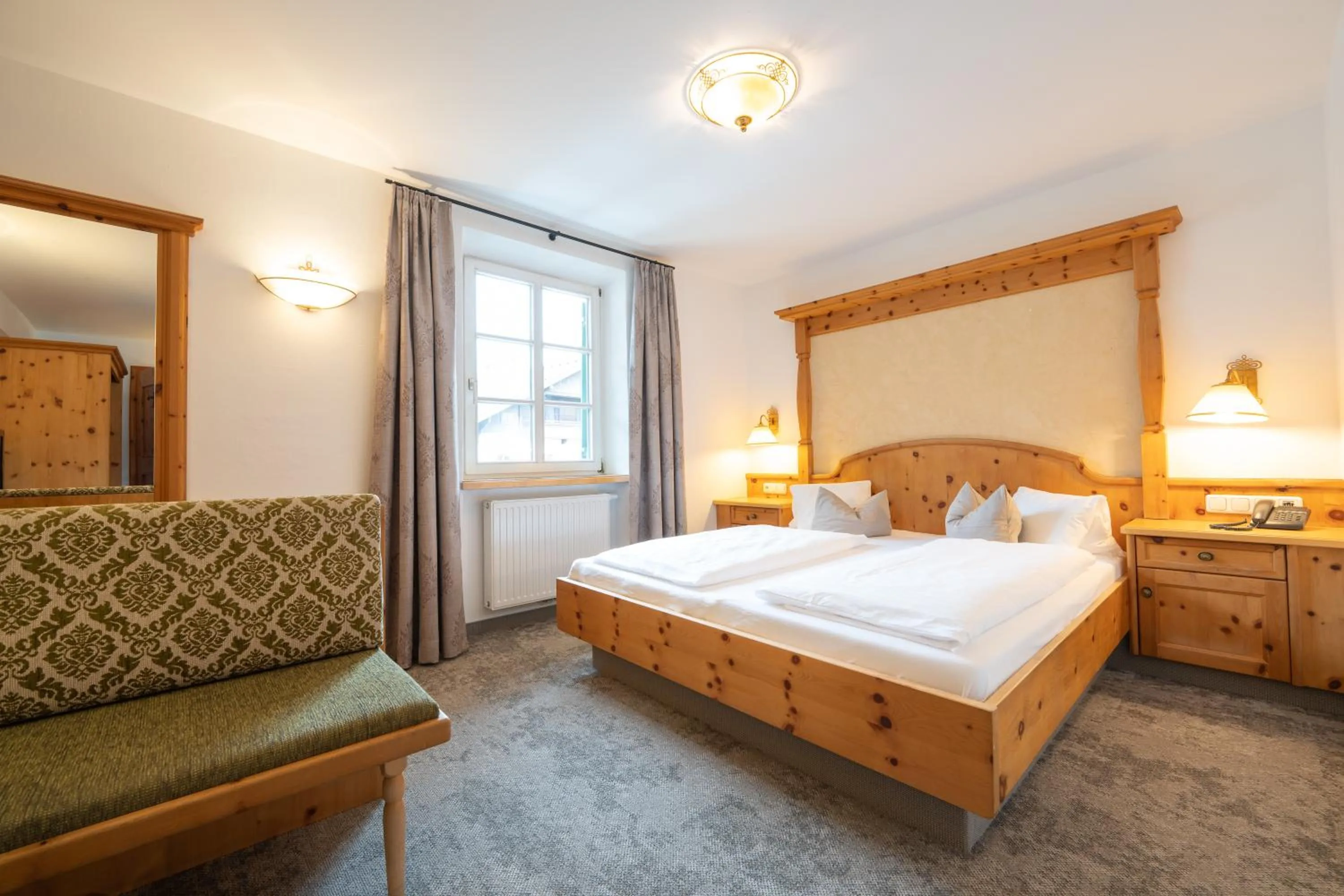 Bed in Alpenhotel Kramerwirt