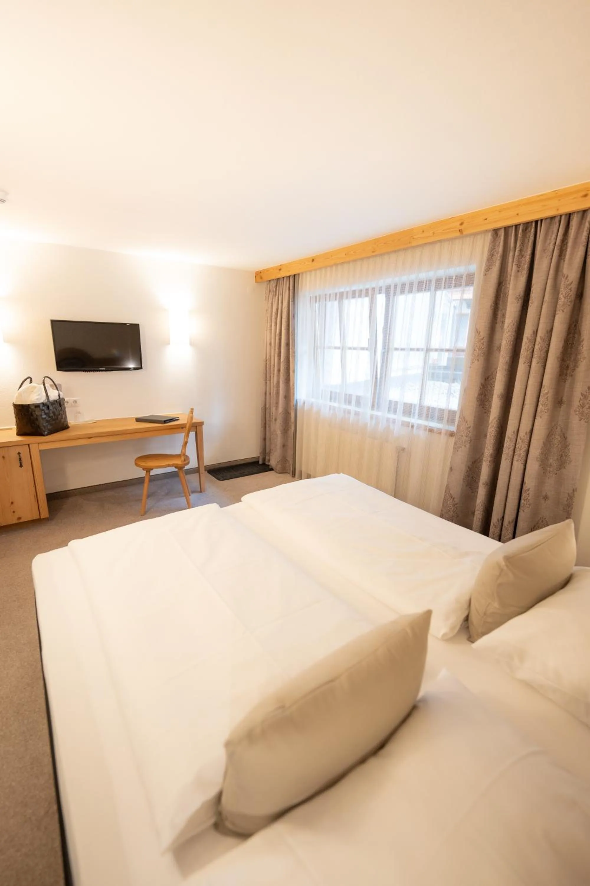 Bed in Alpenhotel Kramerwirt