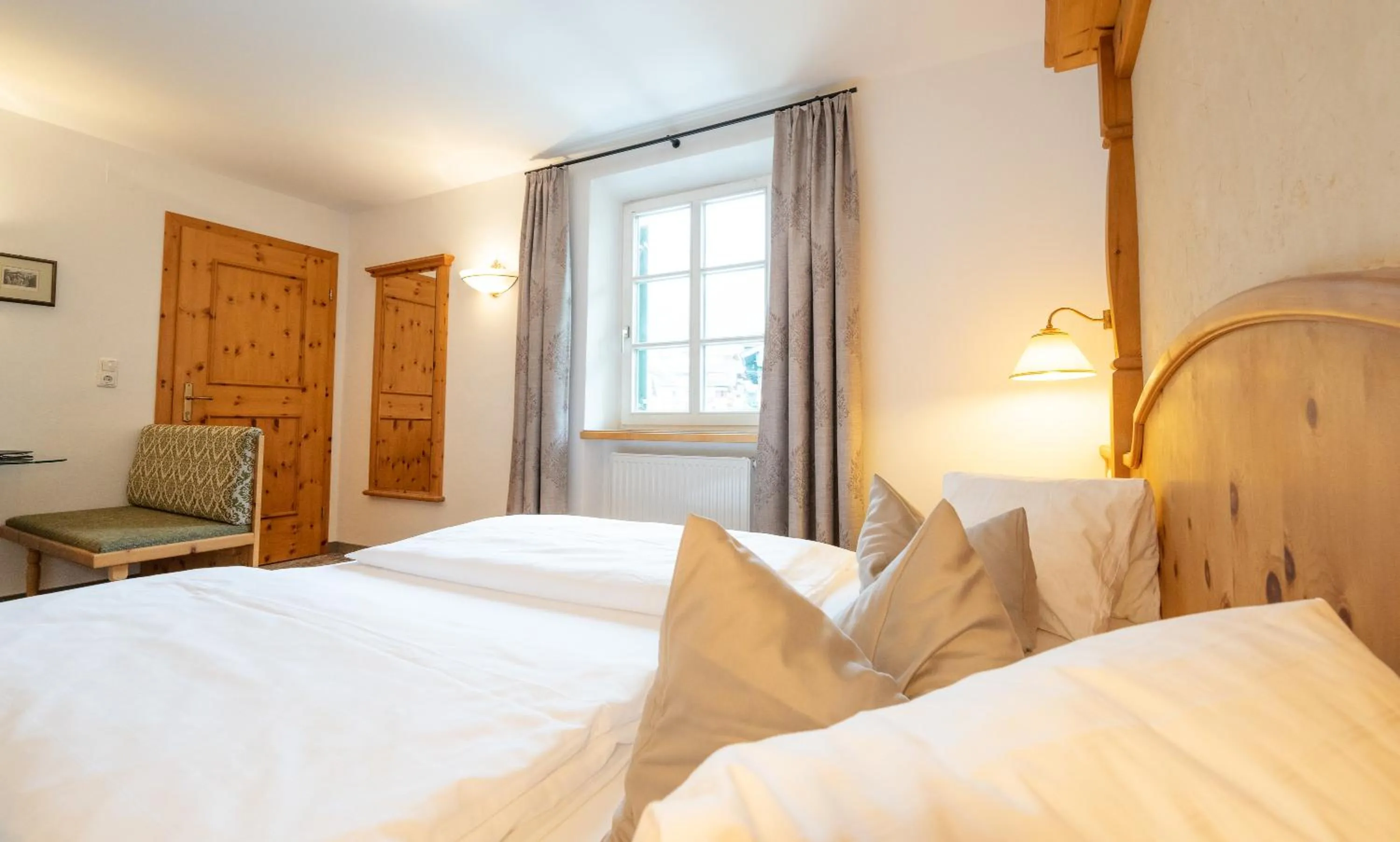 Bed in Alpenhotel Kramerwirt