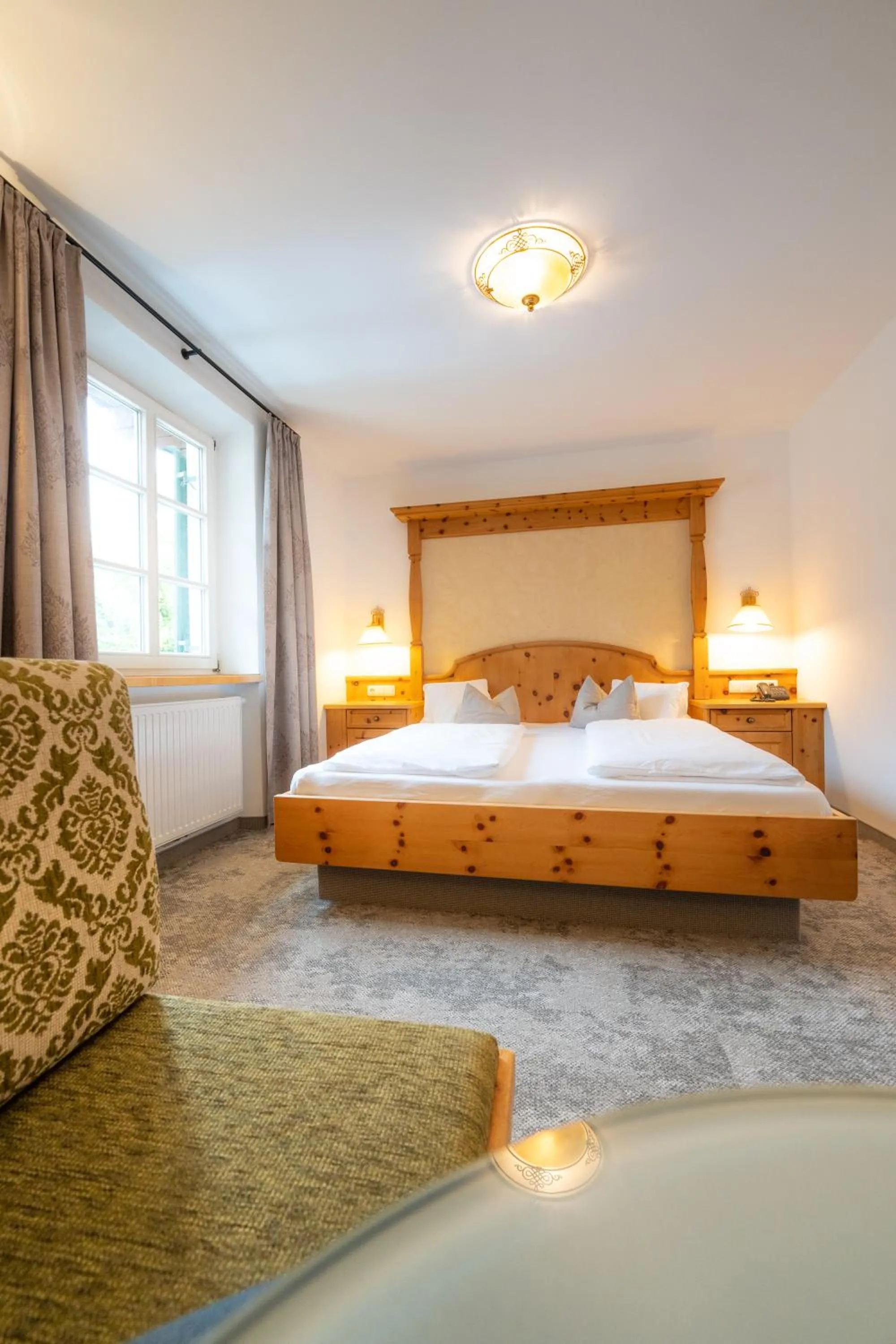 Bed in Alpenhotel Kramerwirt