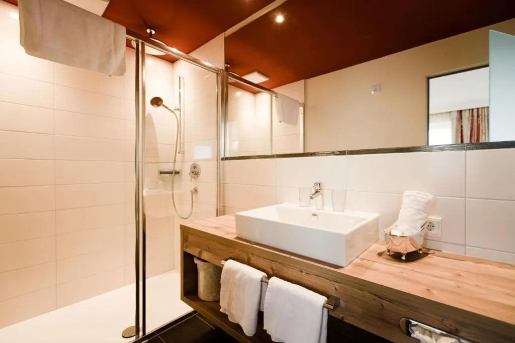 Shower in Aparthotel Dorfplatzl Garni Apartments & B&B