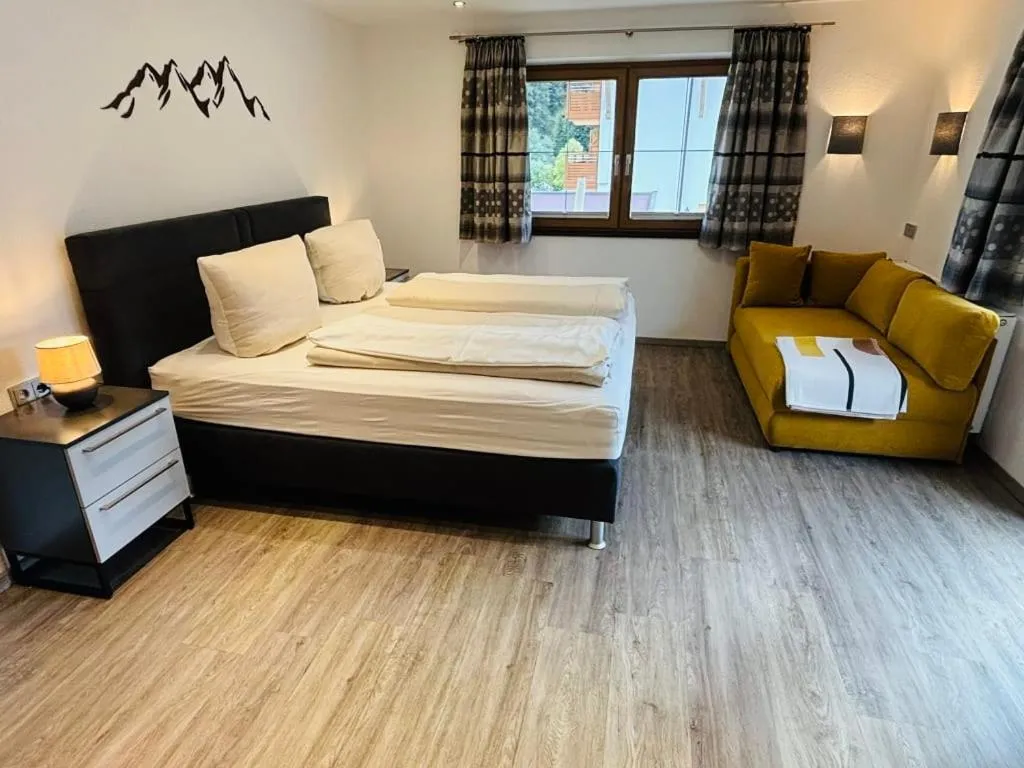 Bed in Aparthotel Dorfplatzl Garni Apartments & B&B