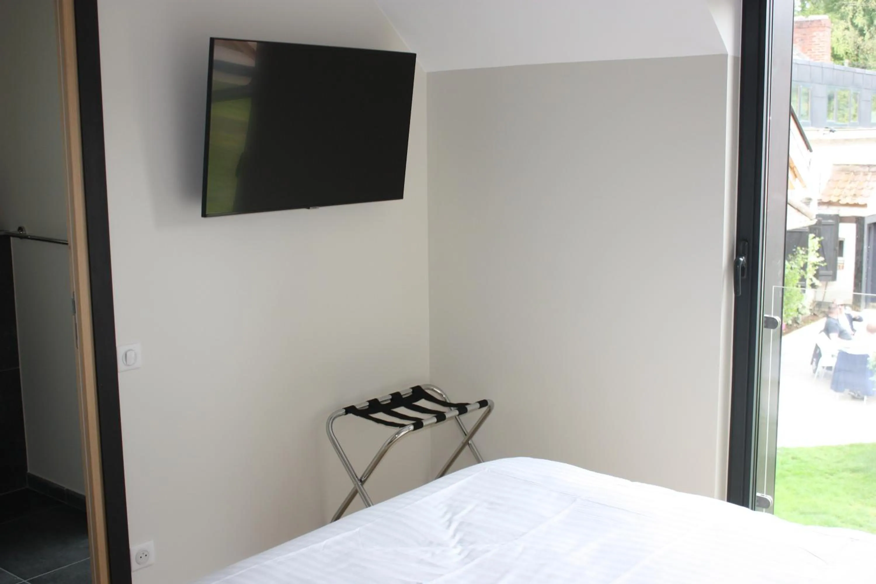 Photo of the whole room in La Ferme Blanche, The Originals Relais