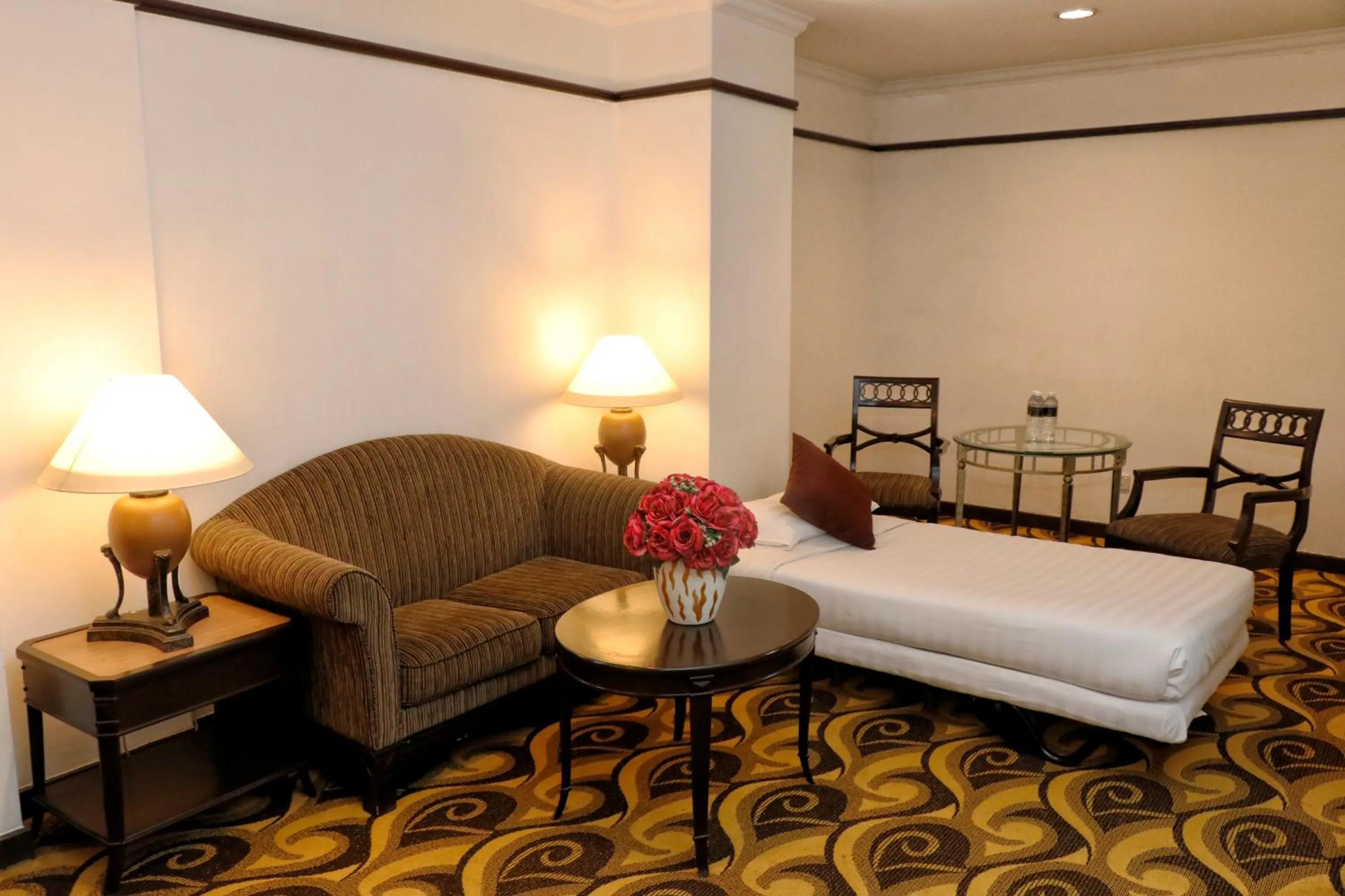 Living room, Bed in Mardhiyyah Hotel and Suites