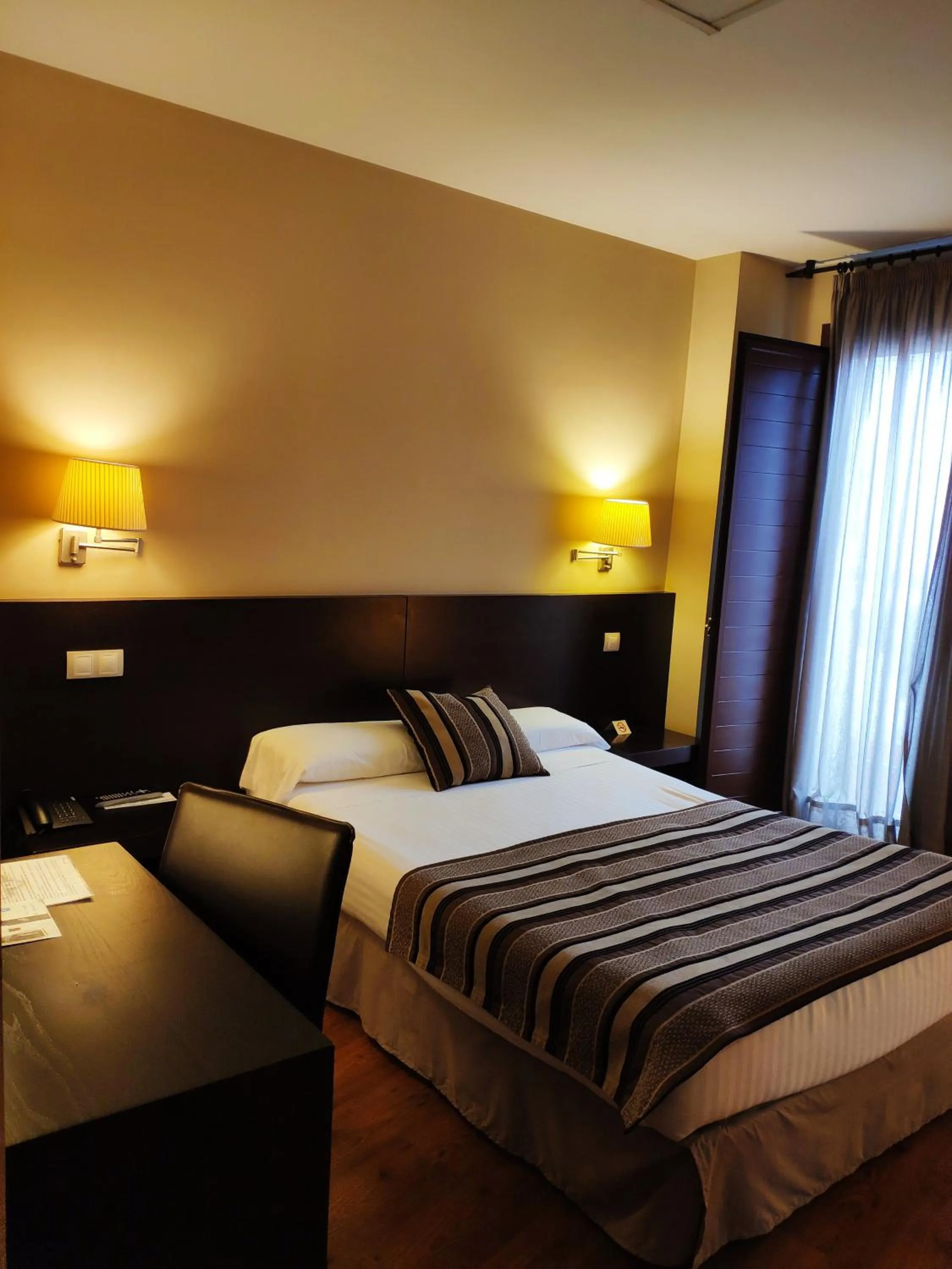 Bed in Hotel Puerta del Arco