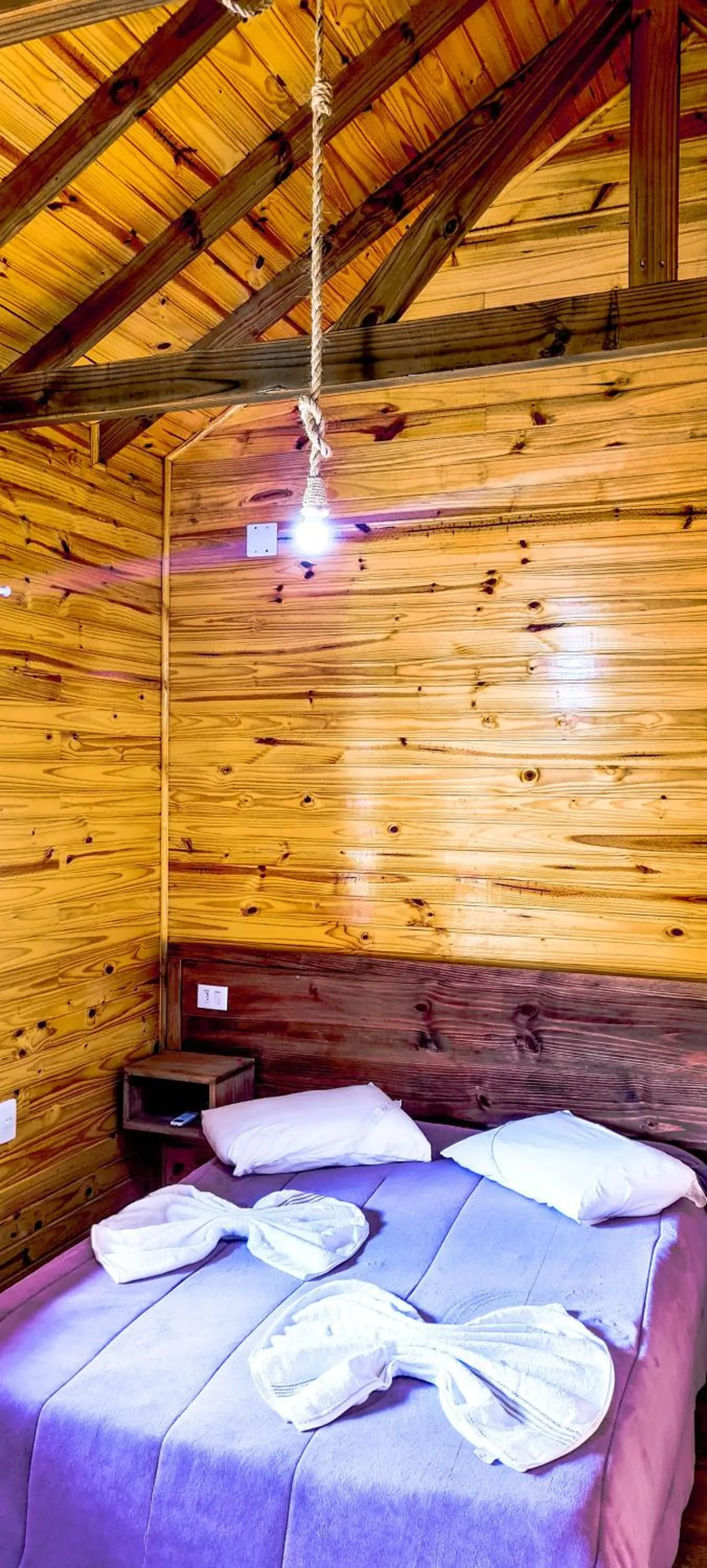 Bed in Pousada Santa Terezinha