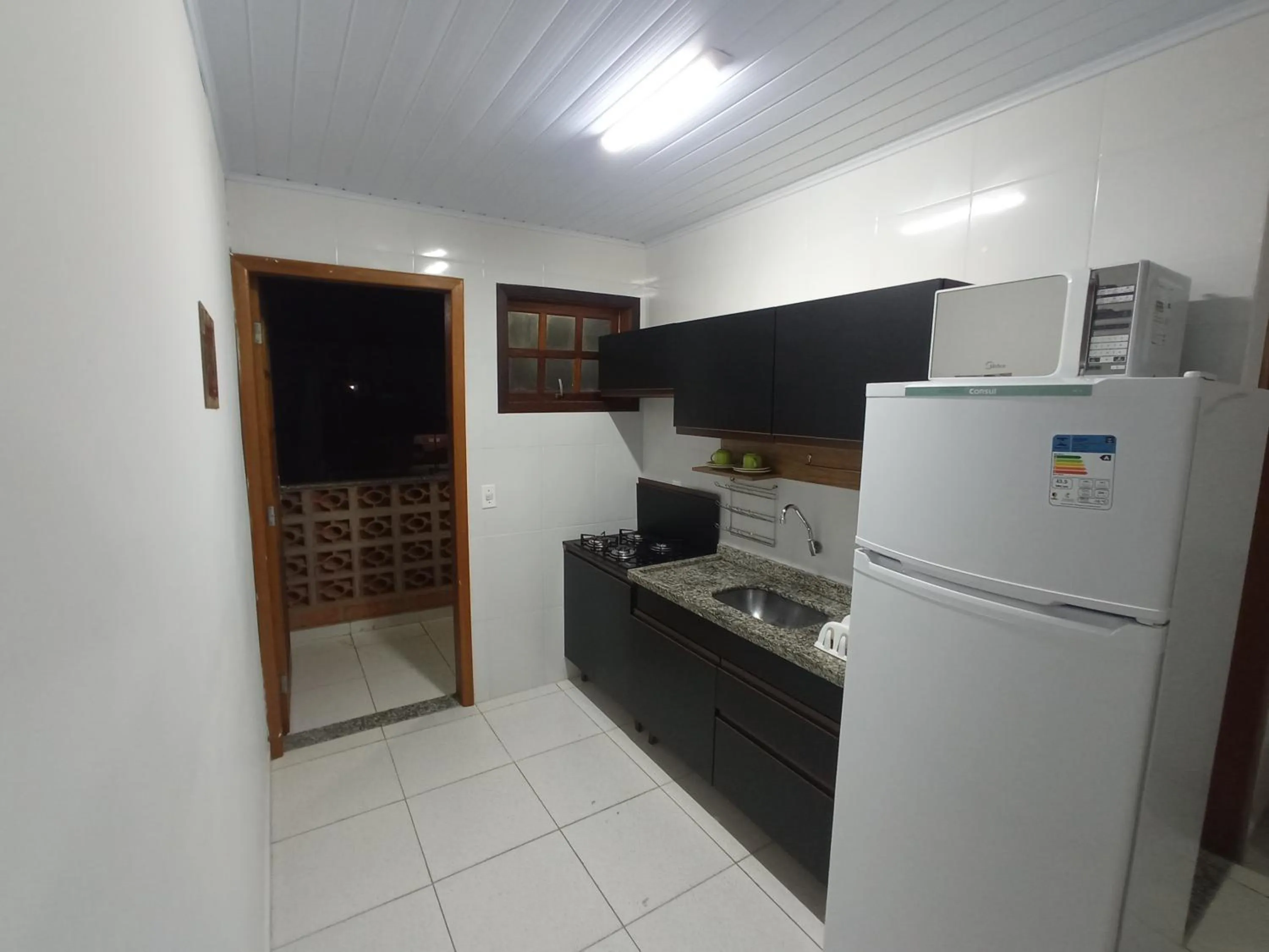 Kitchen or kitchenette in Maranduba Ville II