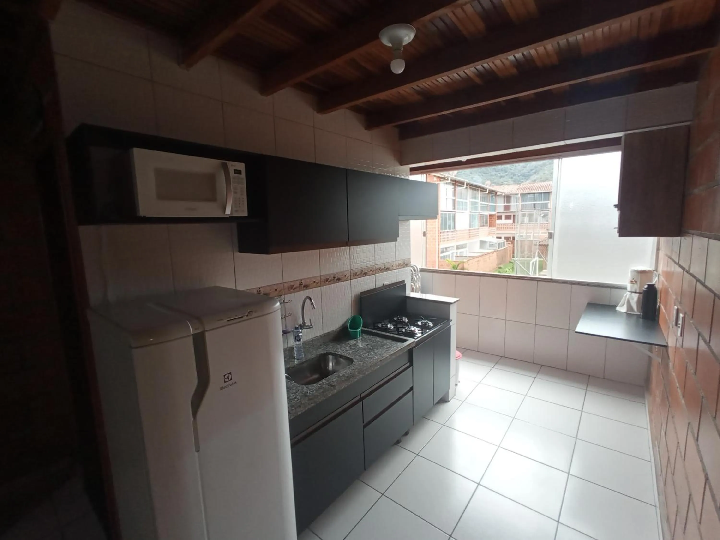 Kitchen or kitchenette in Maranduba Ville II
