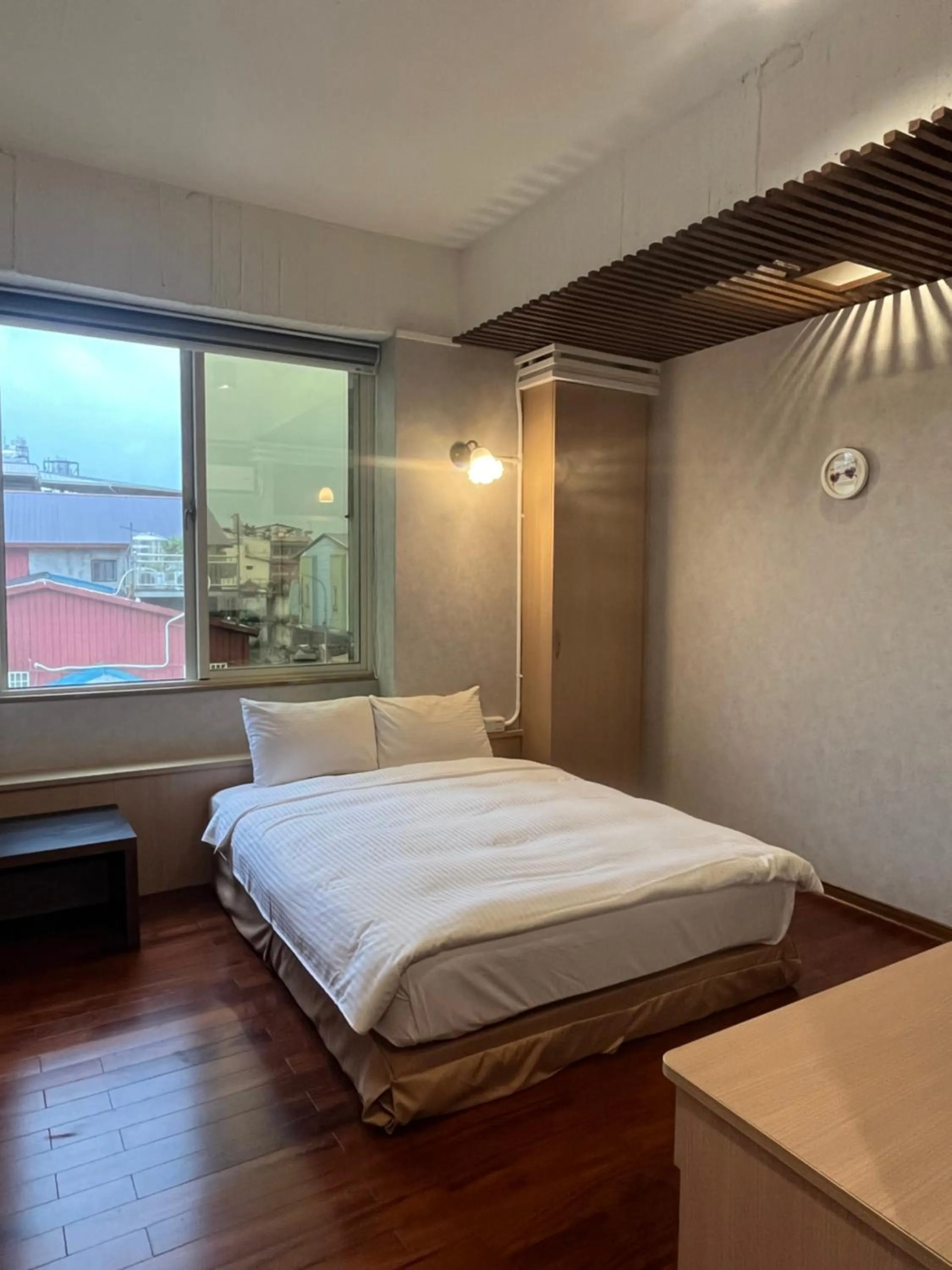 Bed in 日月潭魚池鄉秀水民宿Xiu Shui Hotel