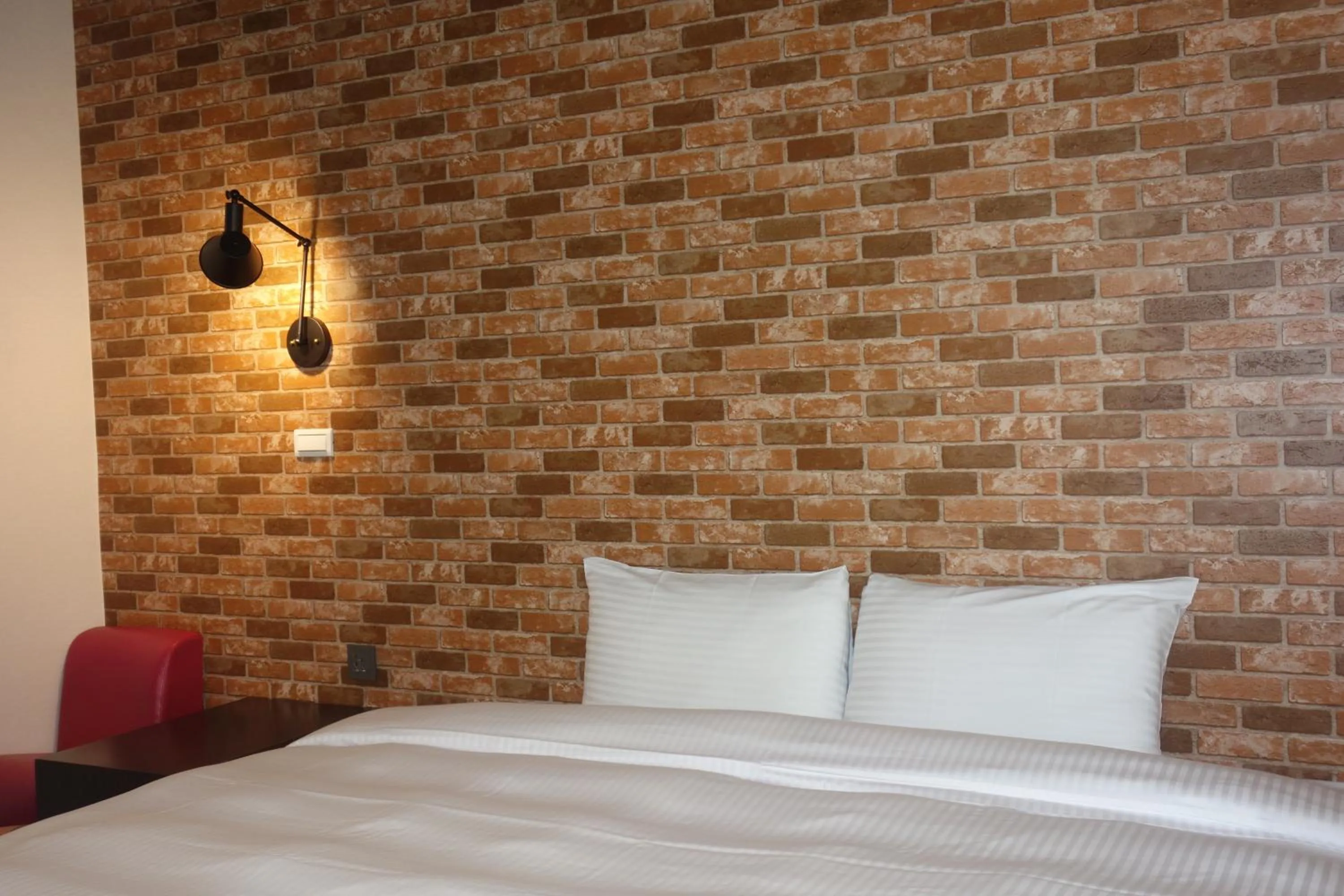 Bed in 日月潭魚池鄉秀水民宿Xiu Shui Hotel