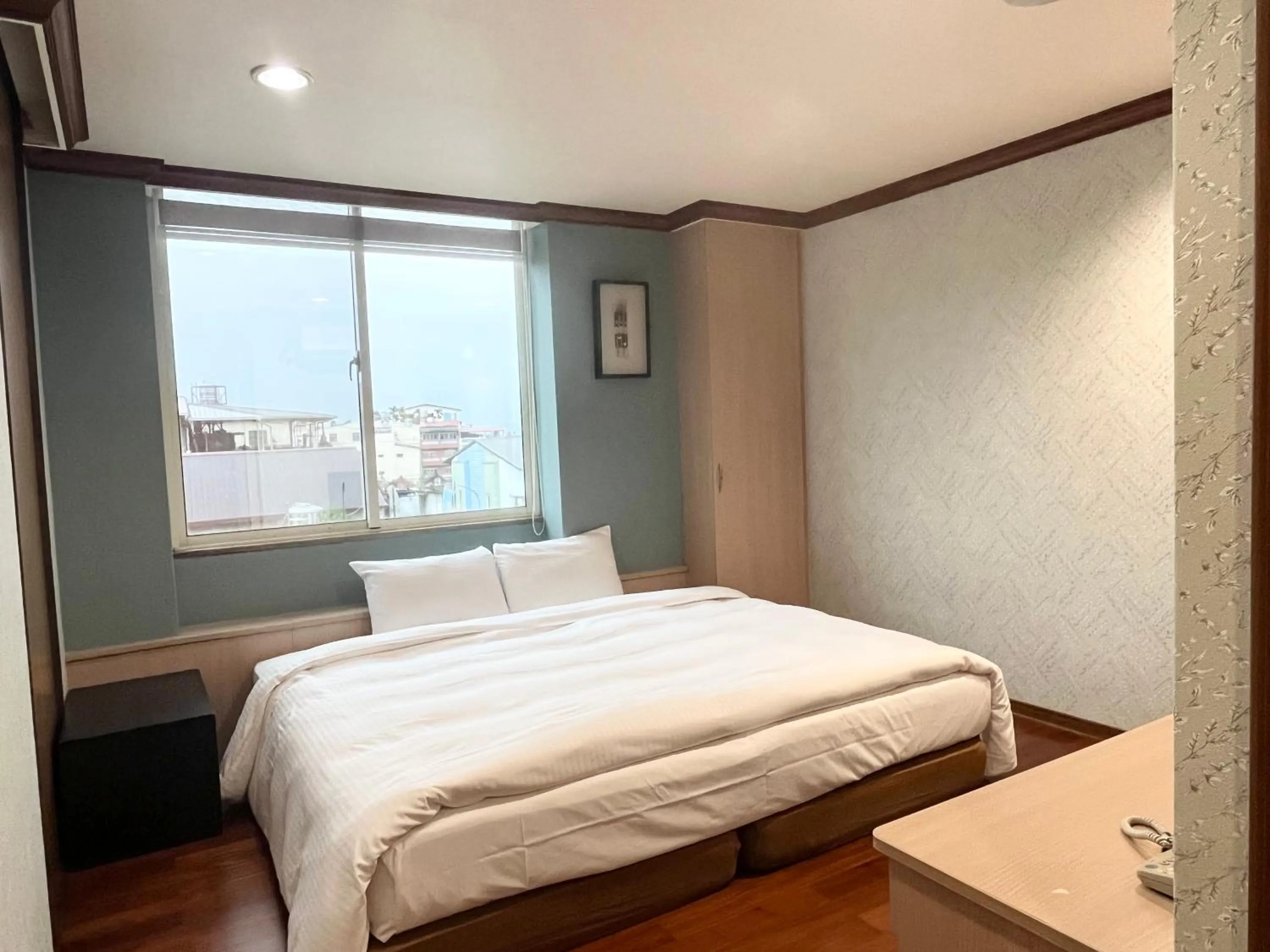 Bed in 日月潭魚池鄉秀水民宿Xiu Shui Hotel