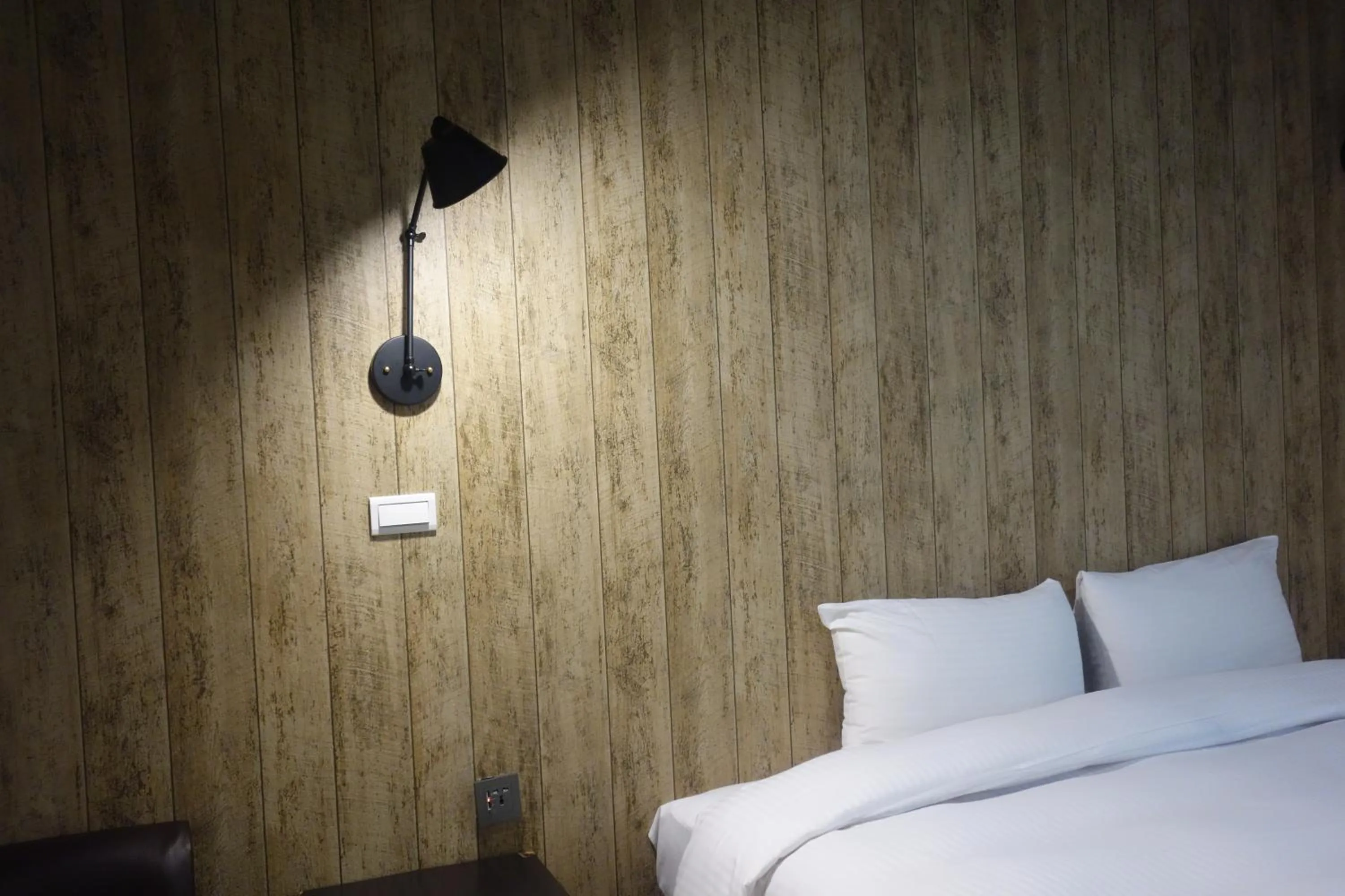 Bed in 日月潭魚池鄉秀水民宿Xiu Shui Hotel