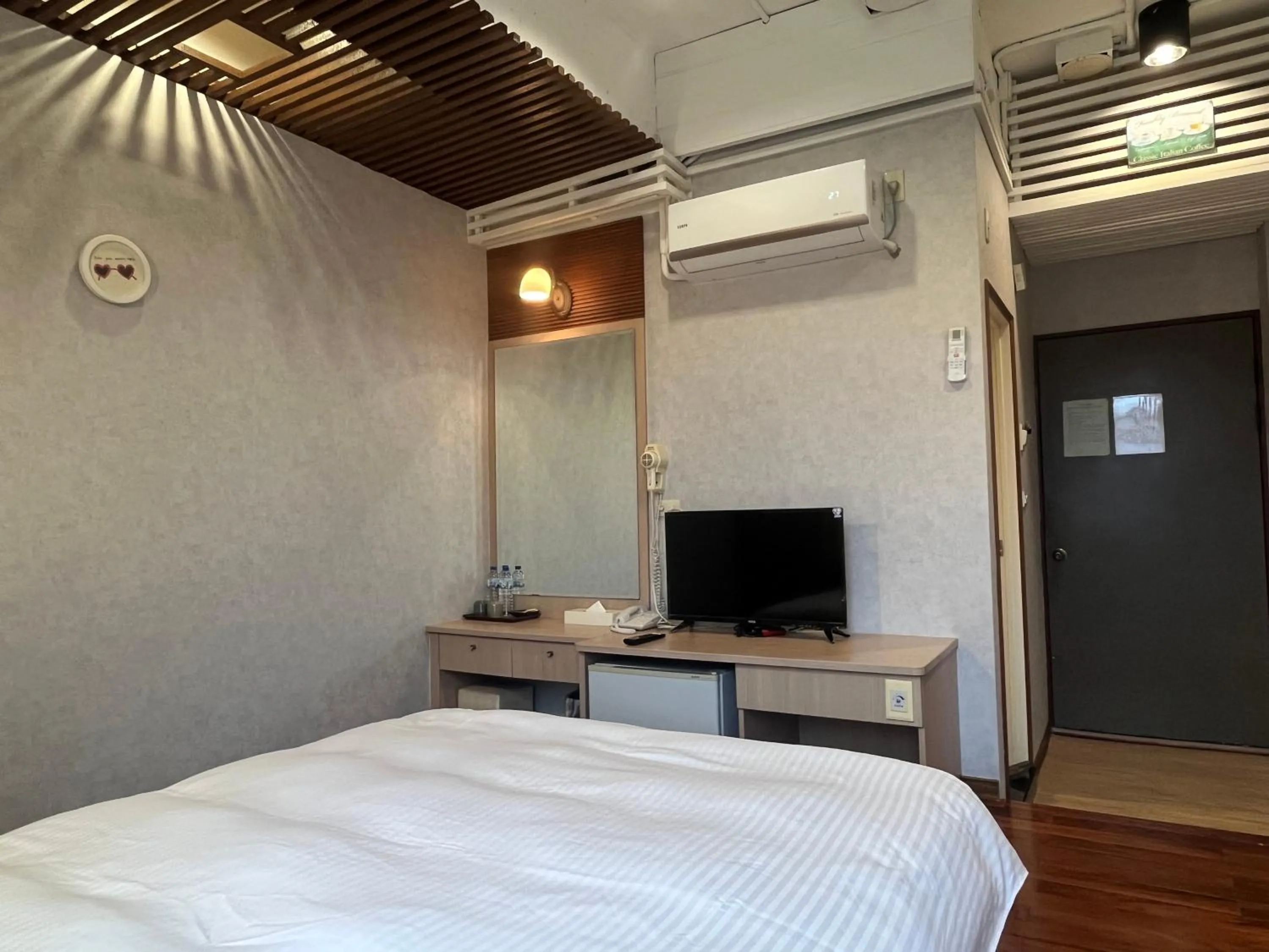 Bed in 日月潭魚池鄉秀水民宿Xiu Shui Hotel