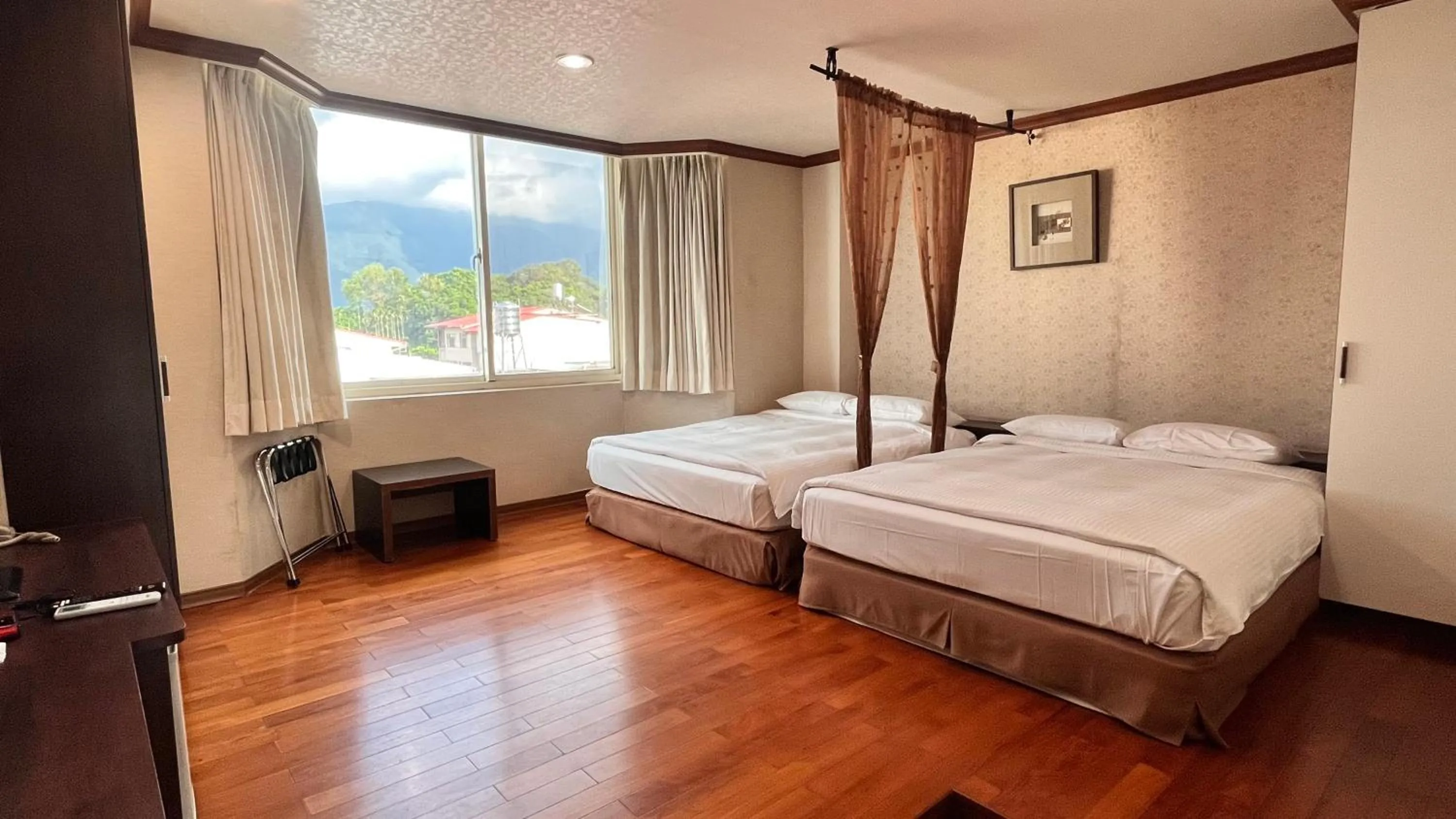 Bed in 日月潭魚池鄉秀水民宿Xiu Shui Hotel