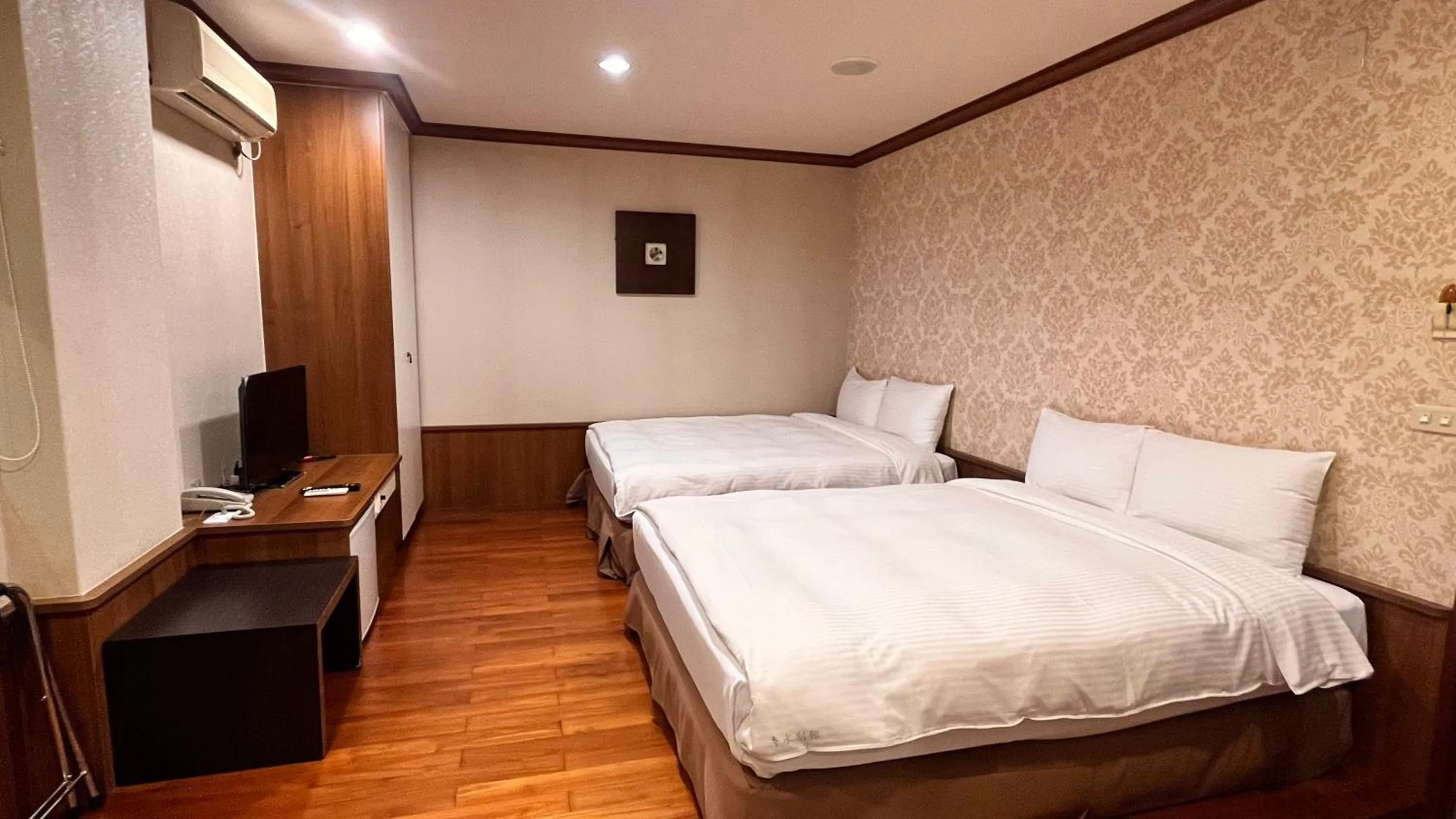 Bed in 日月潭魚池鄉秀水民宿Xiu Shui Hotel