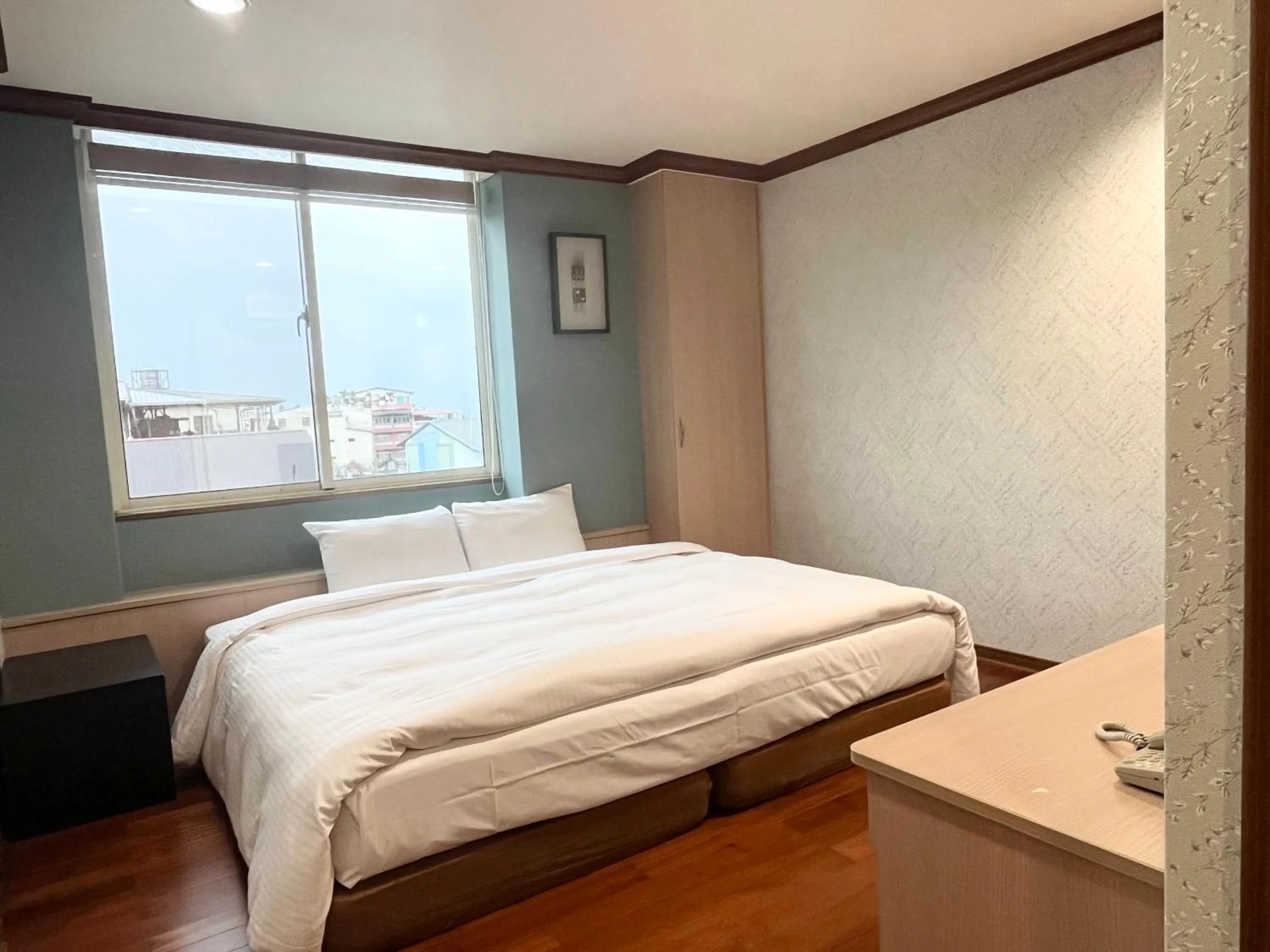 Bed in 日月潭魚池鄉秀水民宿Xiu Shui Hotel