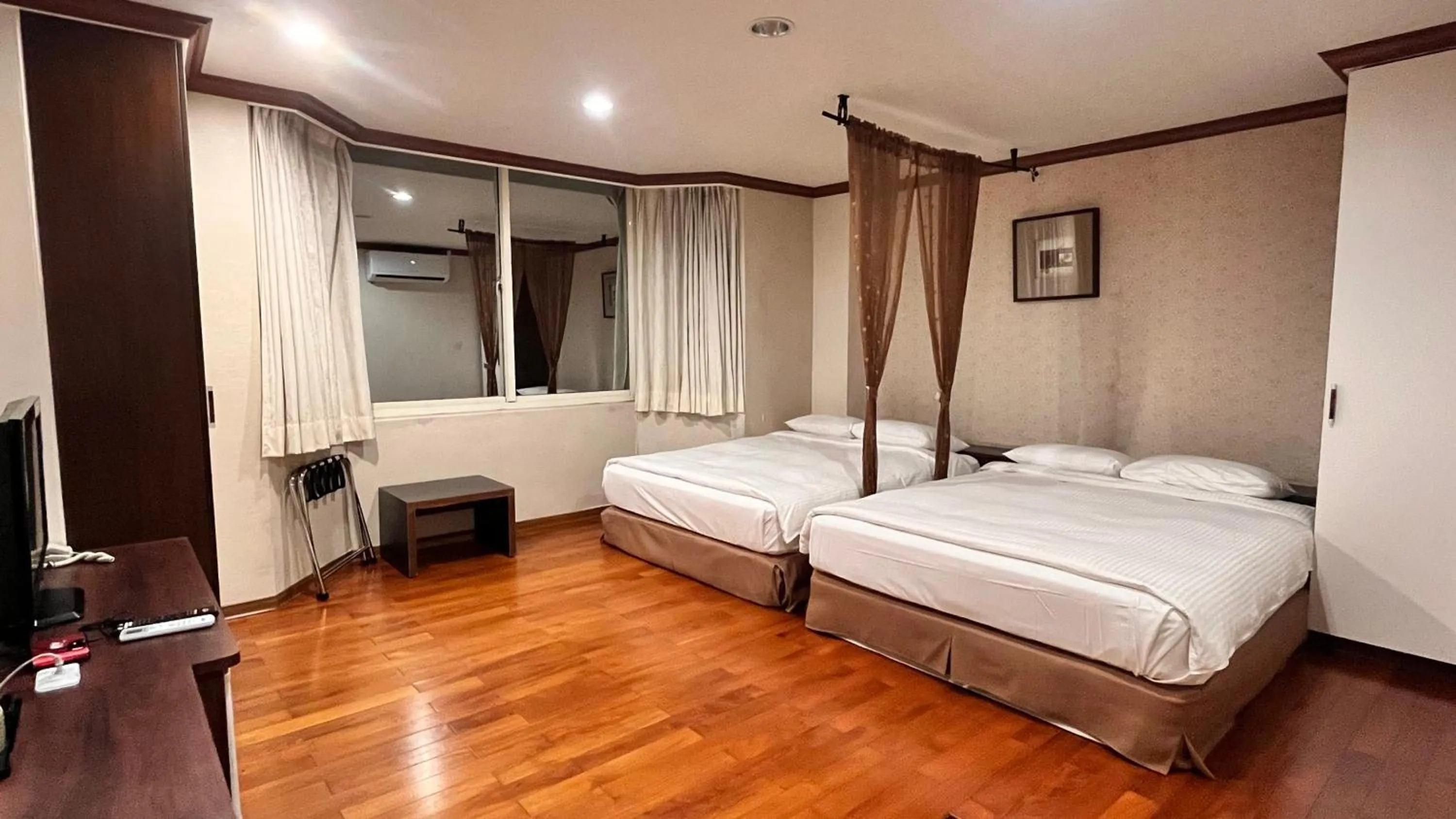 Bed in 日月潭魚池鄉秀水民宿Xiu Shui Hotel