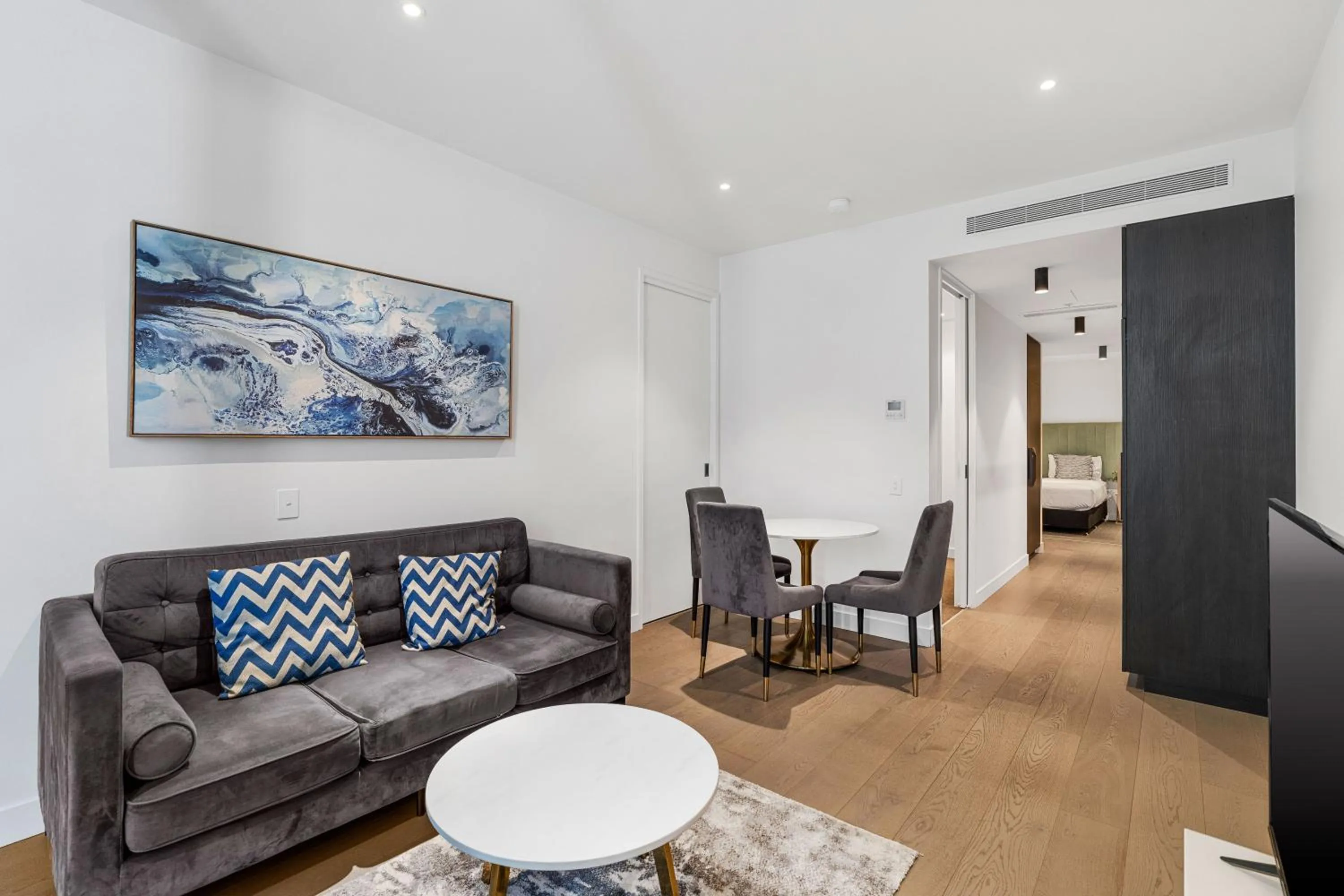 Living room in The Eminence Apartments by CLLIX