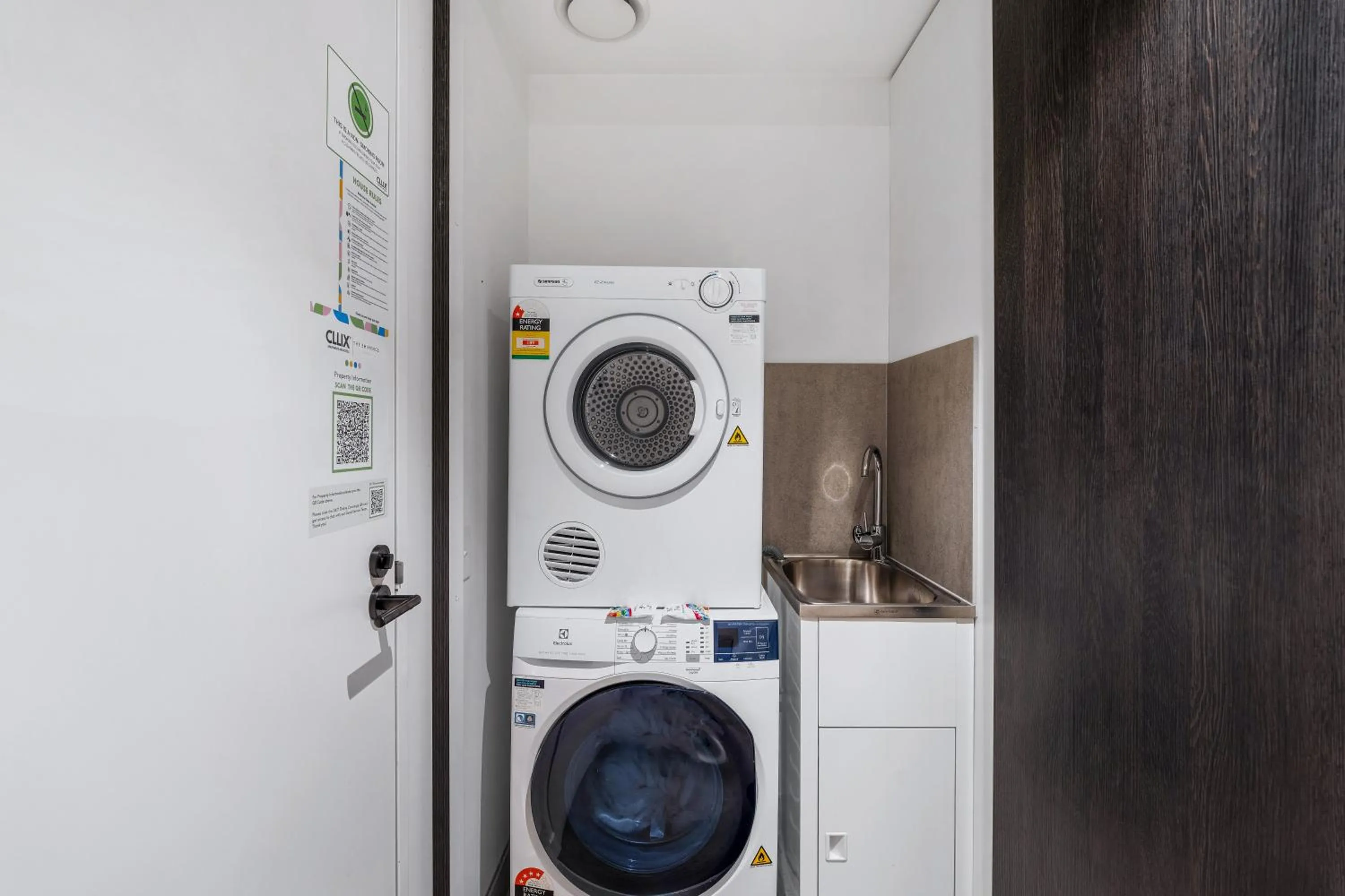 washing machine in The Eminence Apartments by CLLIX