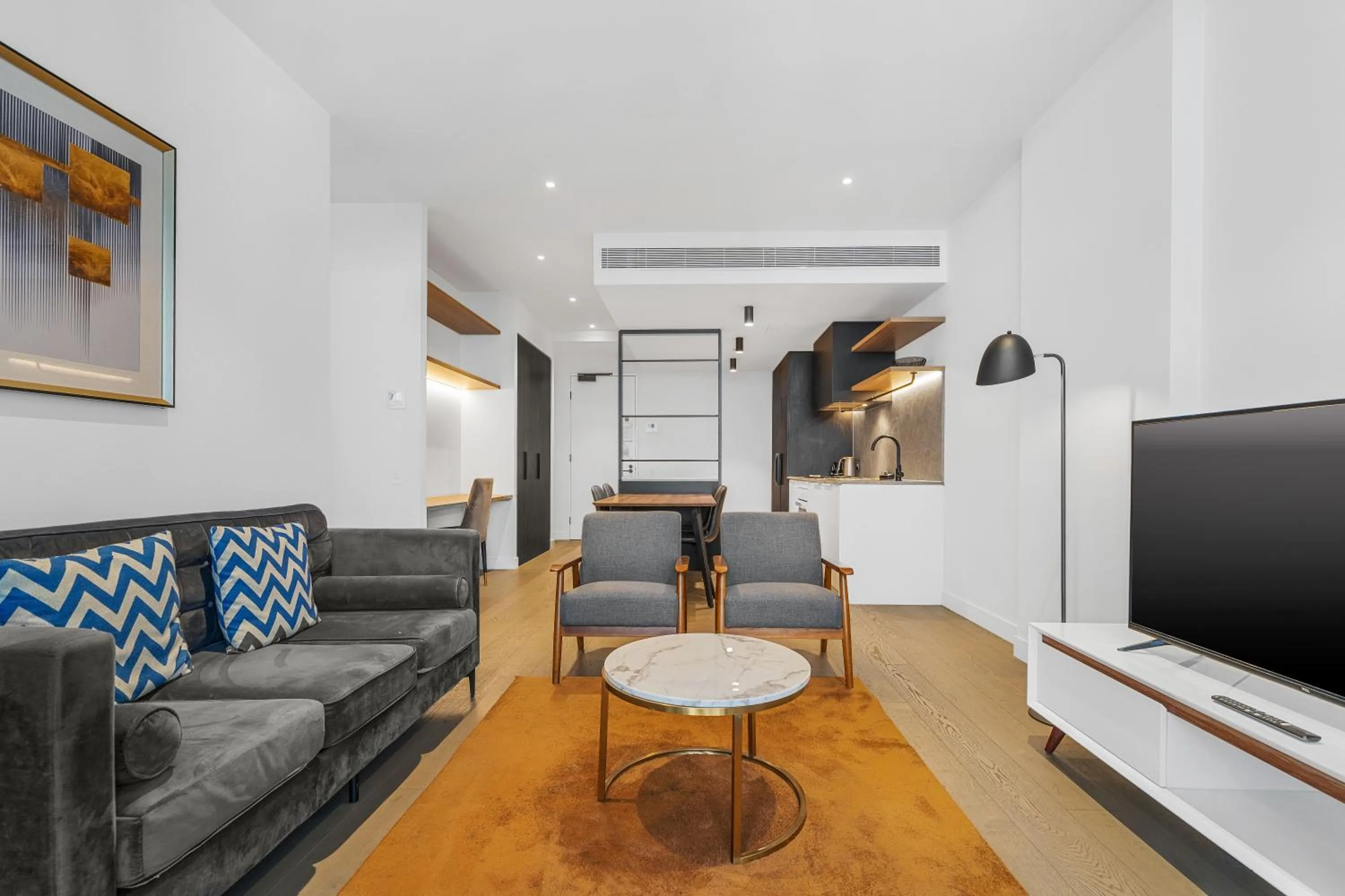 Living room in The Eminence Apartments by CLLIX