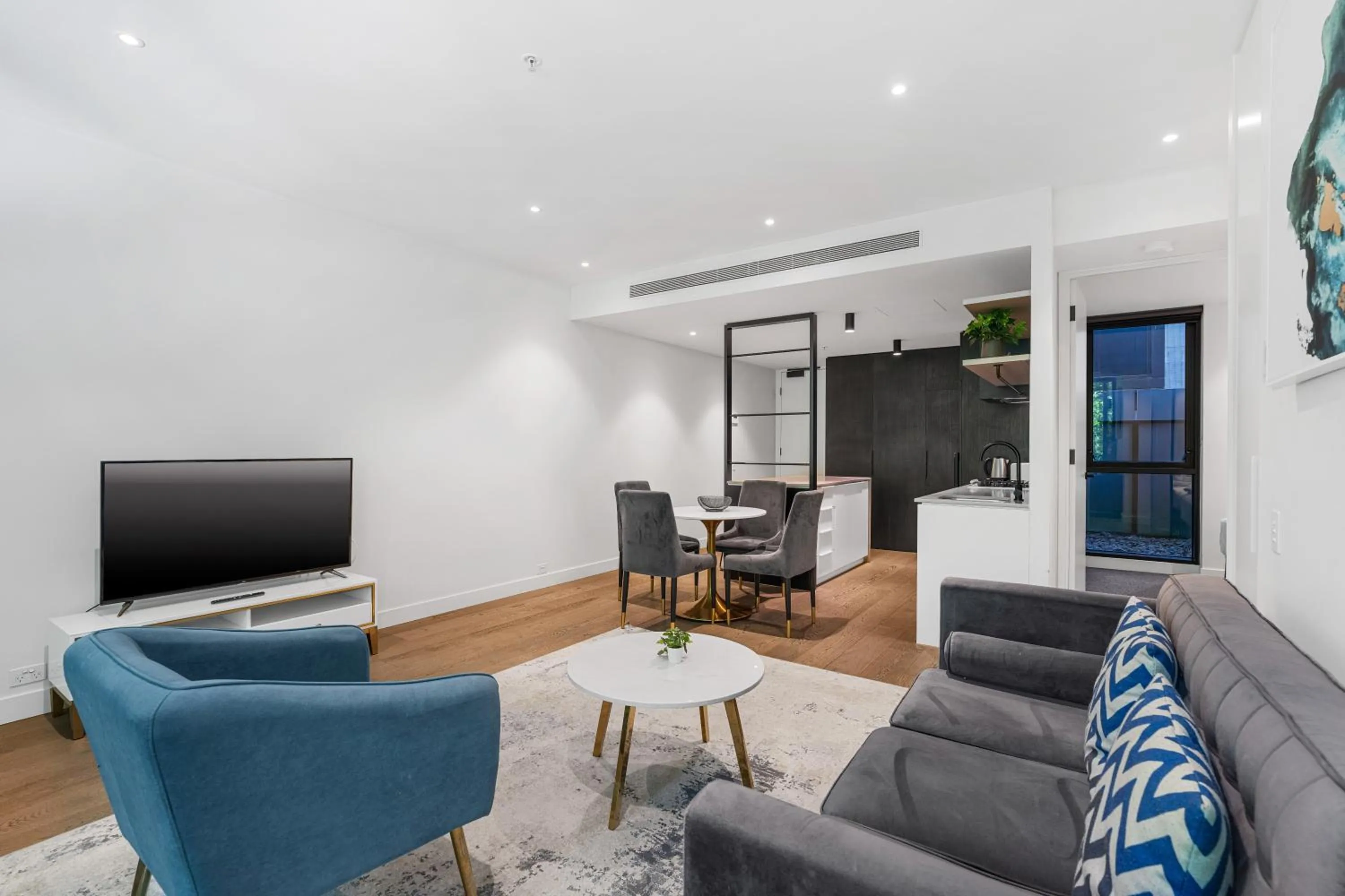 Living room in The Eminence Apartments by CLLIX