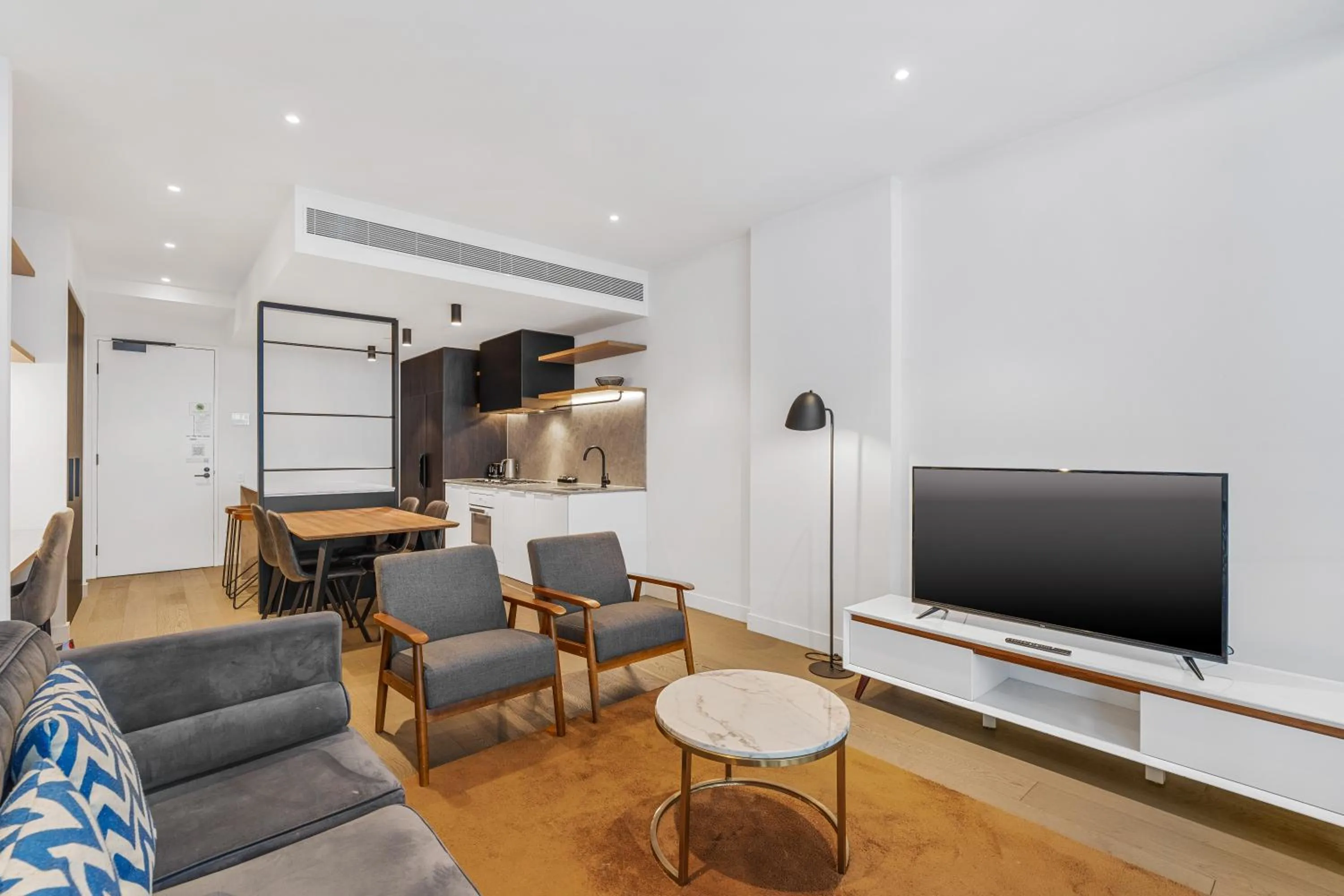 Living room in The Eminence Apartments by CLLIX