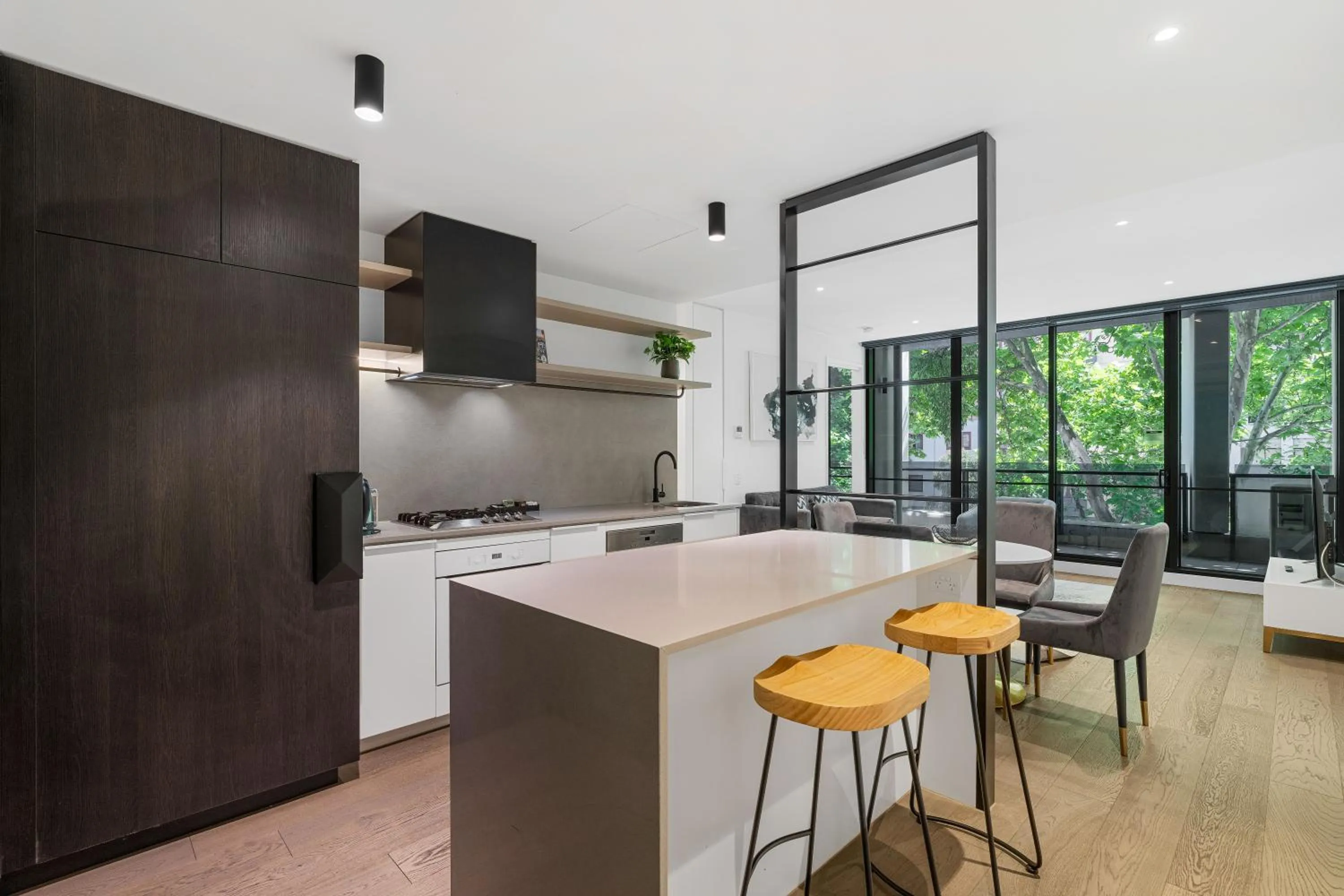 Kitchen or kitchenette in The Eminence Apartments by CLLIX