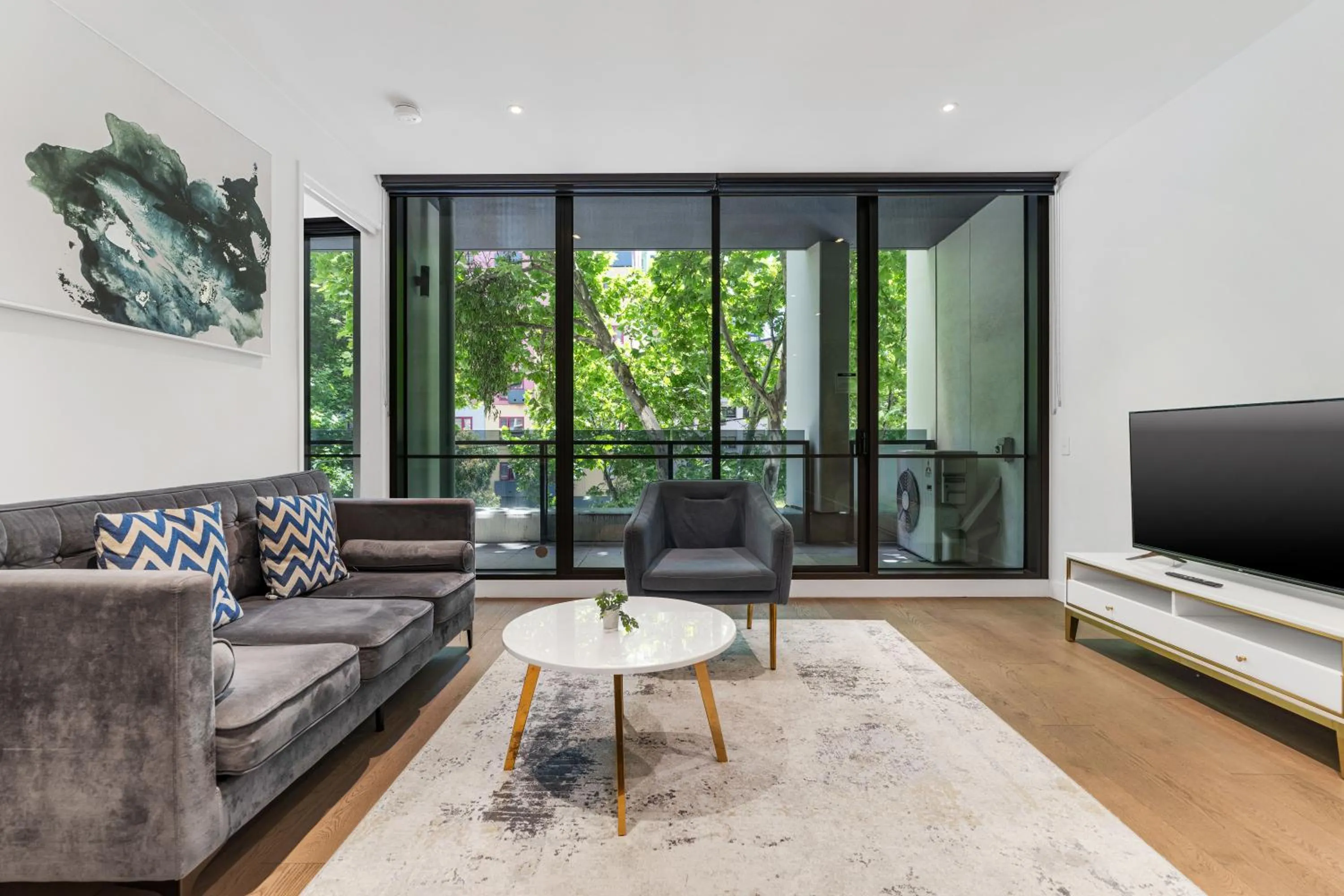 Living room in The Eminence Apartments by CLLIX